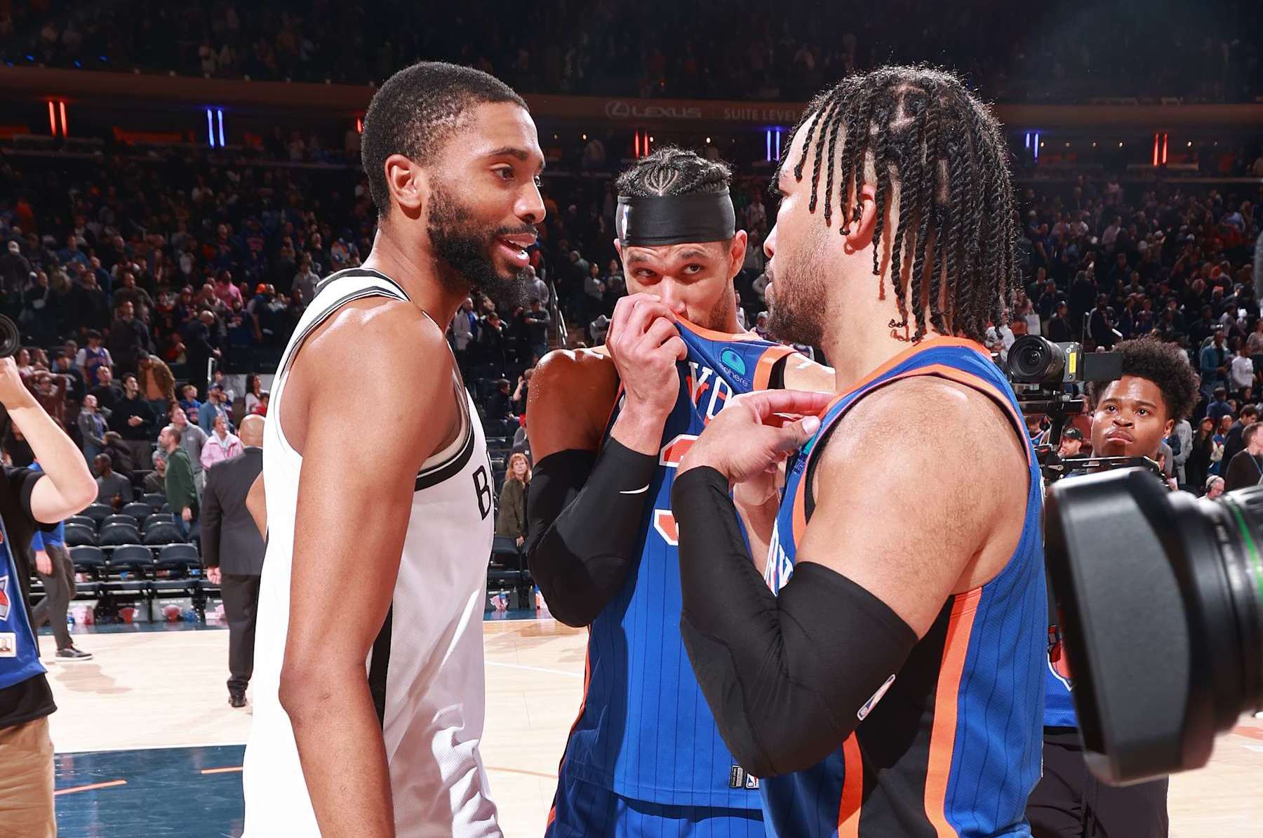 NEW YORK, NY - MARCH 23: Jalen Brunson #11 and Josh Hart #3 of the New York Knicks talk to Mikal Bridges #1 of the Brooklyn Nets after the game on March 23, 2024 at Madison Square Garden in New York City, New York. NOTE TO USER: User expressly acknowledges and agrees that, by downloading and or using this photograph, User is consenting to the terms and conditions of the Getty Images License Agreement. Mandatory Copyright Notice: Copyright 2024 NBAE (Photo by Nathaniel S. Butler/NBAE via Getty Images)