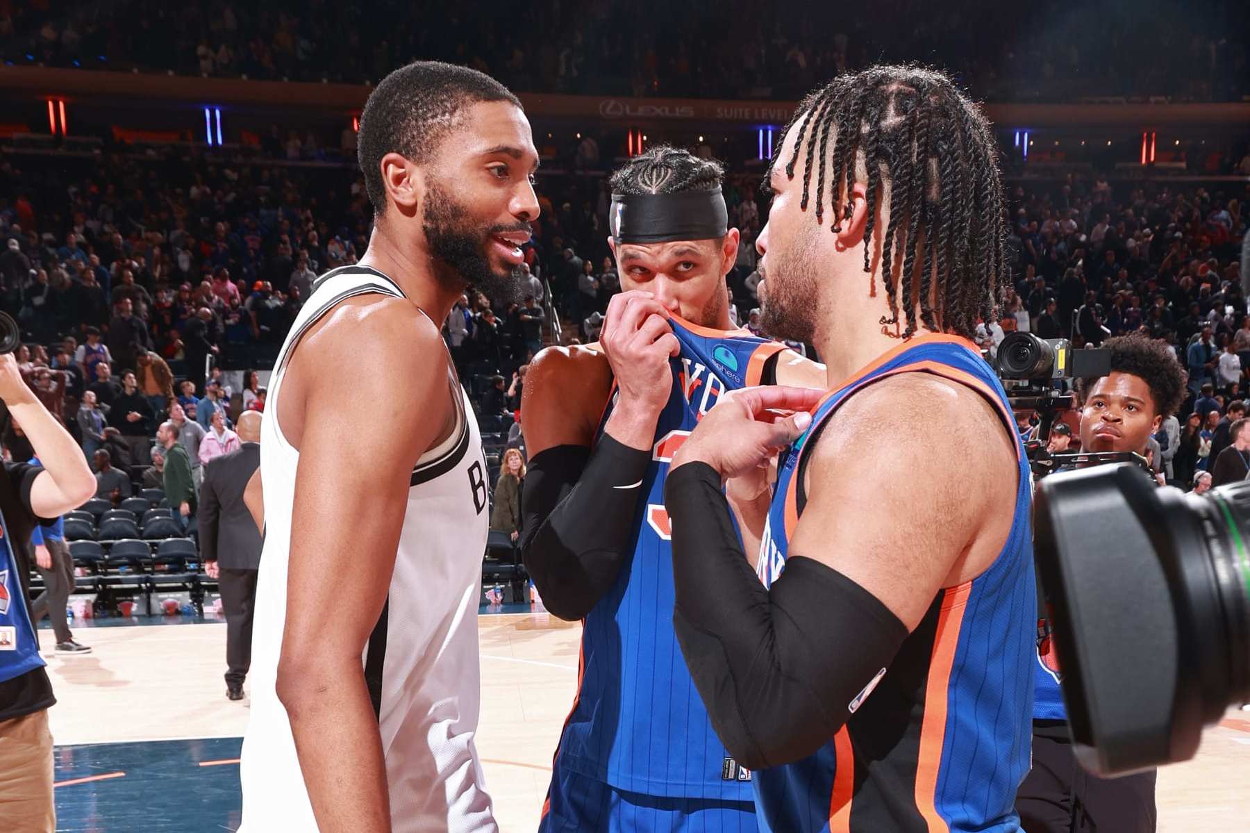 NEW YORK, NY - MARCH 23: Jalen Brunson #11 and Josh Hart #3 of the New York Knicks talk to Mikal Bridges #1 of the Brooklyn Nets after the game on March 23, 2024 at Madison Square Garden in New York City, New York. NOTE TO USER: User expressly acknowledges and agrees that, by downloading and or using this photograph, User is consenting to the terms and conditions of the Getty Images License Agreement. Mandatory Copyright Notice: Copyright 2024 NBAE (Photo by Nathaniel S. Butler/NBAE via Getty Images)