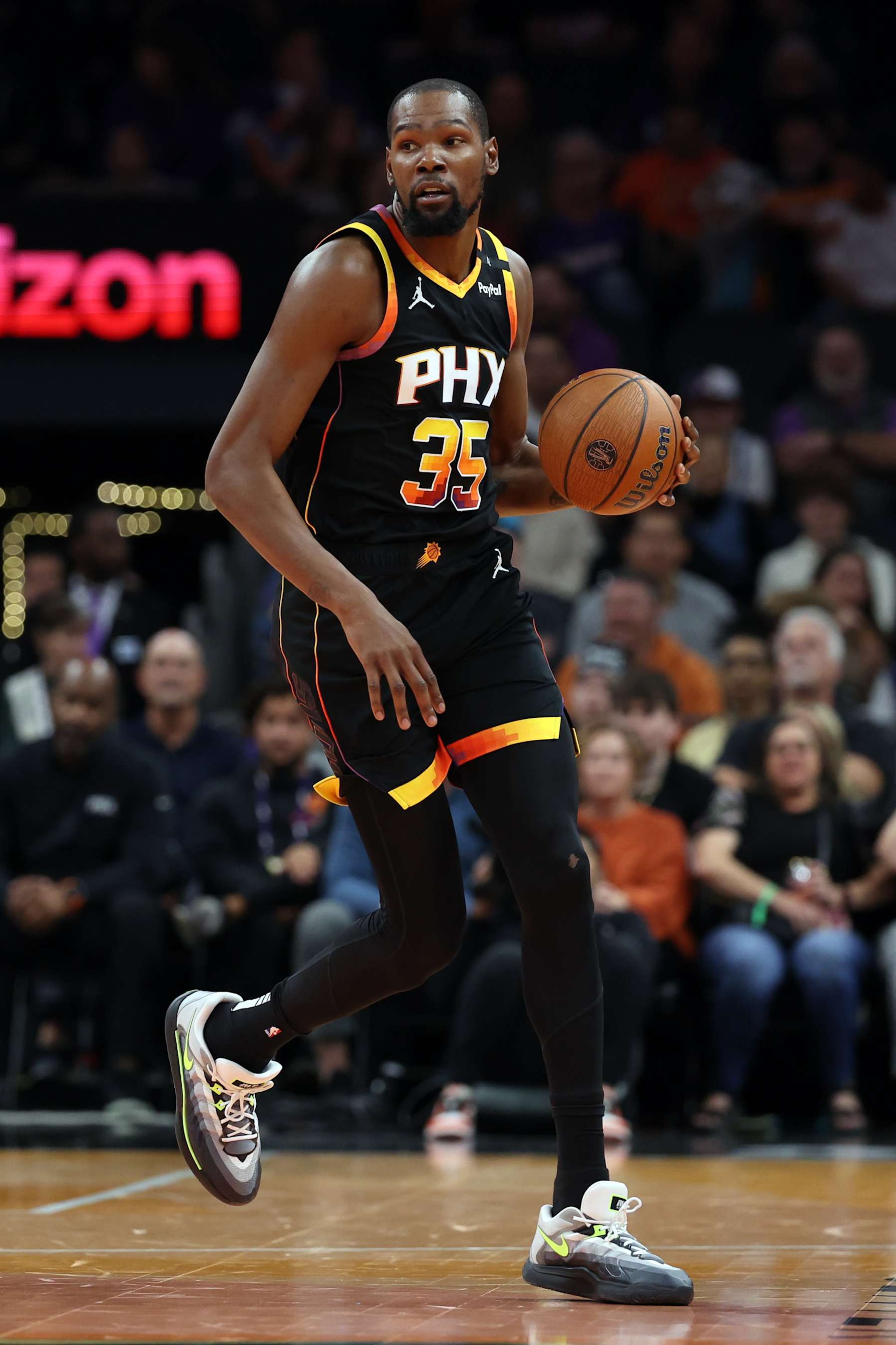 PHOENIX, ARIZONA - DECEMBER 03: Kevin Durant #35 of the Phoenix Suns controls the ball during the first half of the Emirates NBA Cup game against the San Antonio Spurs at Footprint Center on December 03, 2024 in Phoenix, Arizona. The Suns defeated the Spurs 104-93. NOTE TO USER: User expressly acknowledges and agrees that, by downloading and or using this photograph, User is consenting to the terms and conditions of the Getty Images License Agreement.  (Photo by Chris Coduto/Getty Images)