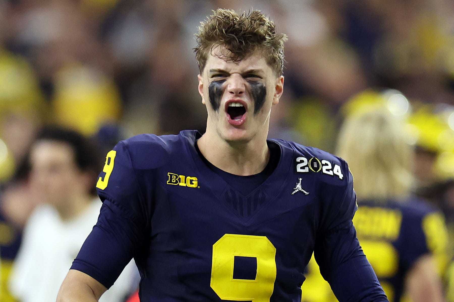 HOUSTON, TEXAS - JANUARY 08: J.J. McCarthy #9 of the Michigan Wolverines reacts in the second half against the Washington Huskies during the 2024 CFP National Championship game at NRG Stadium on January 08, 2024 in Houston, Texas. (Photo by Gregory Shamus/Getty Images)
