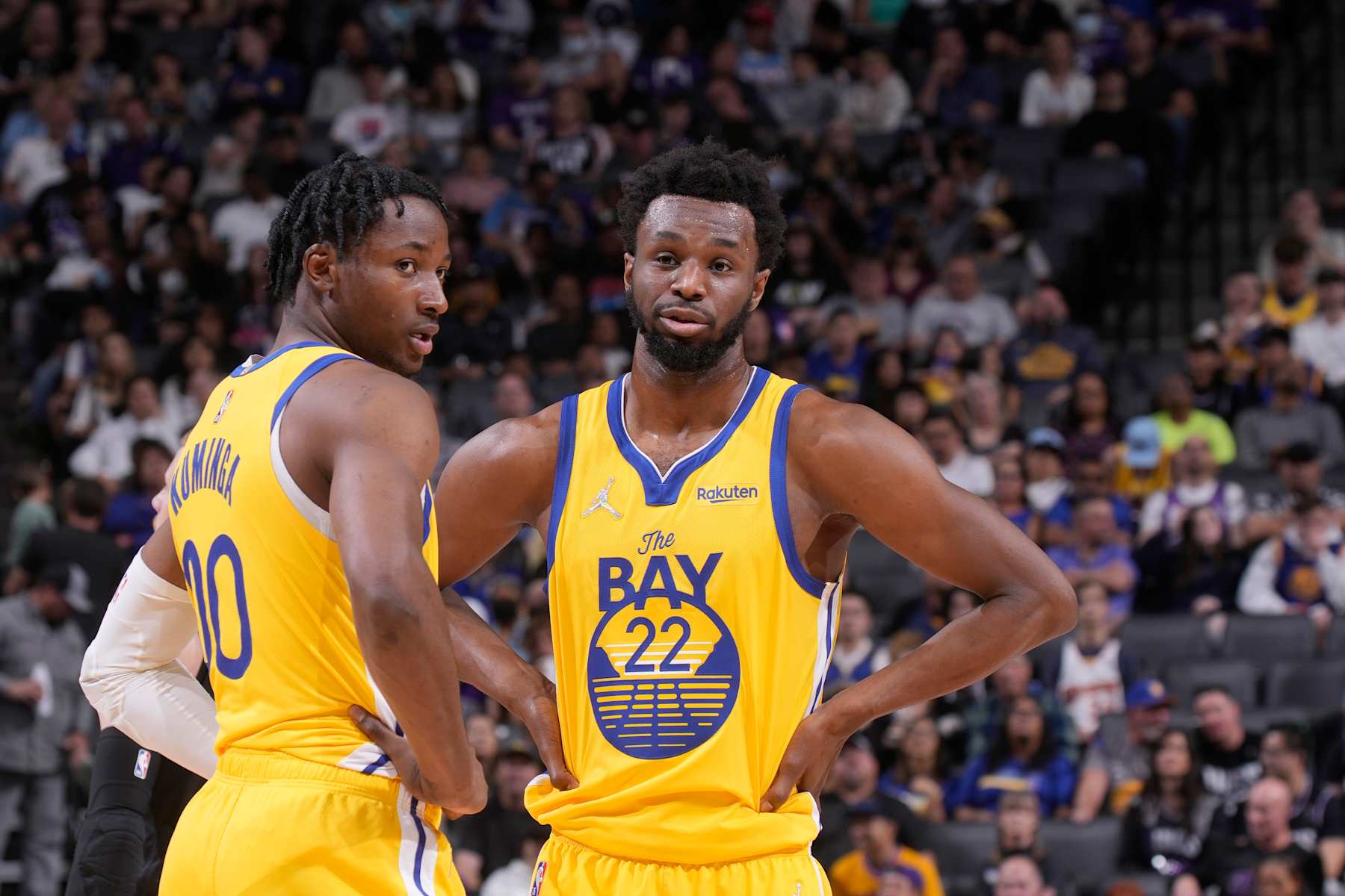 SACRAMENTO, CA - APRIL 3: Jonathan Kuminga #00 and Andrew Wiggins #22 of the Golden State Warriors talk during the game against the Sacramento Kings on April 3, 2022 at Golden 1 Center in Sacramento, California. NOTE TO USER: User expressly acknowledges and agrees that, by downloading and or using this photograph, User is consenting to the terms and conditions of the Getty Images Agreement. Mandatory Copyright Notice: Copyright 2022 NBAE (Photo by Rocky Widner/NBAE via Getty Images)