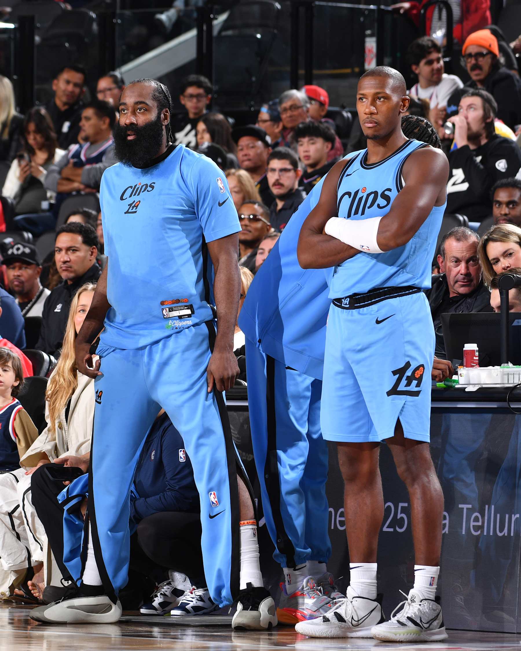 INGLEWOOD, CA - NOVEMBER 17: James Harden #1 and Kris Dunn #8 of the LA Clippers look on during the game against the Utah Jazz on November 17, 2024 at Intuit Dome in Los Angeles, California. NOTE TO USER: User expressly acknowledges and agrees that, by downloading and/or using this Photograph, user is consenting to the terms and conditions of the Getty Images License Agreement. Mandatory Copyright Notice: Copyright 2024 NBAE (Photo by Juan Ocampo/NBAE via Getty Images)
