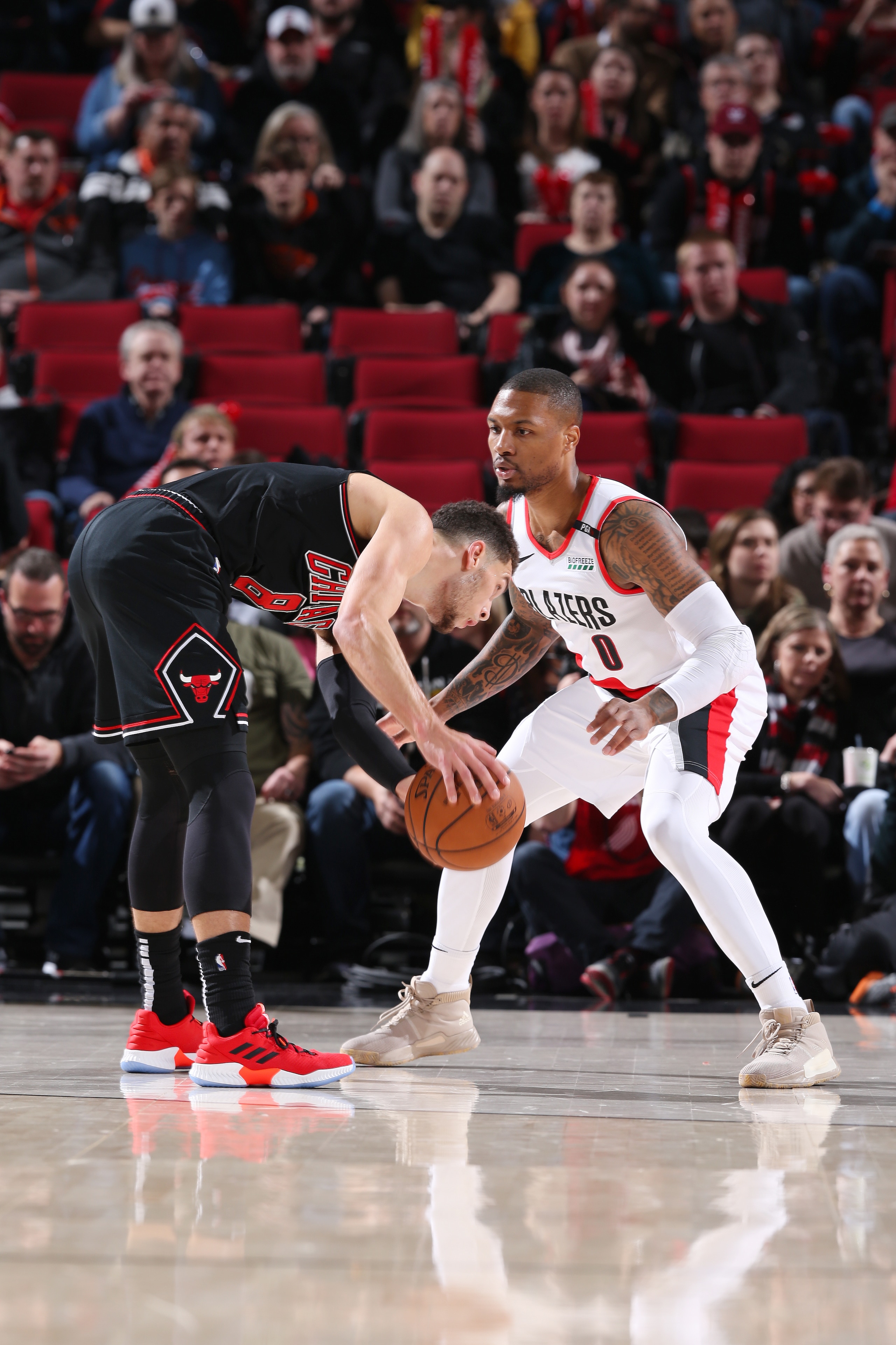 PORTLAND, OR - JANUARY 9: Damian Lillard #0 of the Portland Trail Blazers plays defense against during the game against Zach LaVine #8 of the Chicago Bulls on January 9, 2019 at the Moda Center Arena in Portland, Oregon. NOTE TO USER: User expressly acknowledges and agrees that, by downloading and or using this photograph, user is consenting to the terms and conditions of the Getty Images License Agreement. Mandatory Copyright Notice: Copyright 2019 NBAE (Photo by Sam Forencich/NBAE via Getty Images) PORTLAND, OR - JANUARY 9: Damian Lillard #0 of the Portland Trail Blazers plays defense against during the game against Zach LaVine #8 of the Chicago Bulls on January 9, 2019 at the Moda Center Arena in Portland, Oregon. NOTE TO USER: User expressly acknowledges and agrees that, by downloading and or using this photograph, user is consenting to the terms and conditions of the Getty Images License Agreement. Mandatory Copyright Notice: Copyright 2019 NBAE (Photo by Sam Forencich/NBAE via Getty Images)