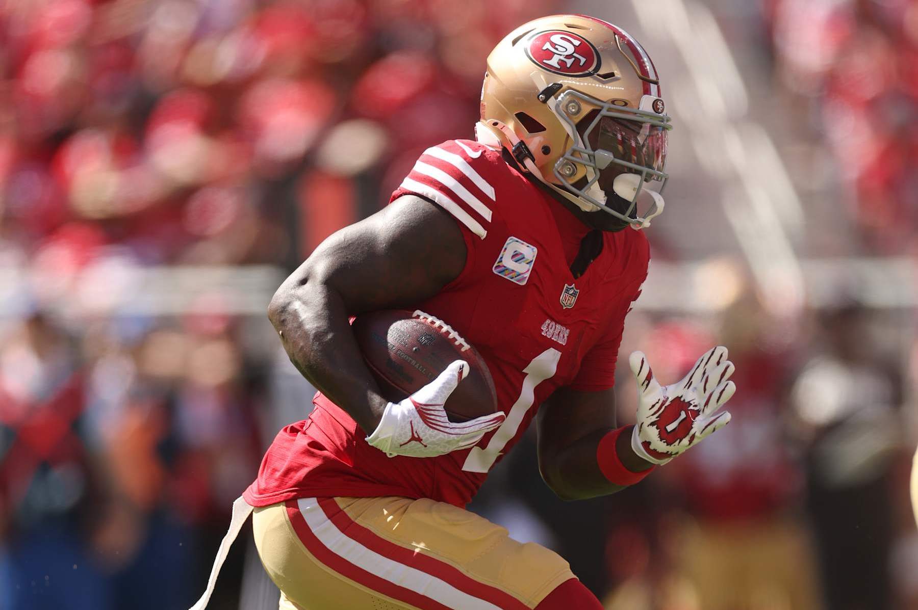 SANTA CLARA, CALIFORNIA - SEPTEMBER 29: Deebo Samuel Sr. #1 of the San Francisco 49ers runs with the ball in the first quarter against the New England Patriots at Levi's Stadium on September 29, 2024 in Santa Clara, California. (Photo by Ezra Shaw/Getty Images)