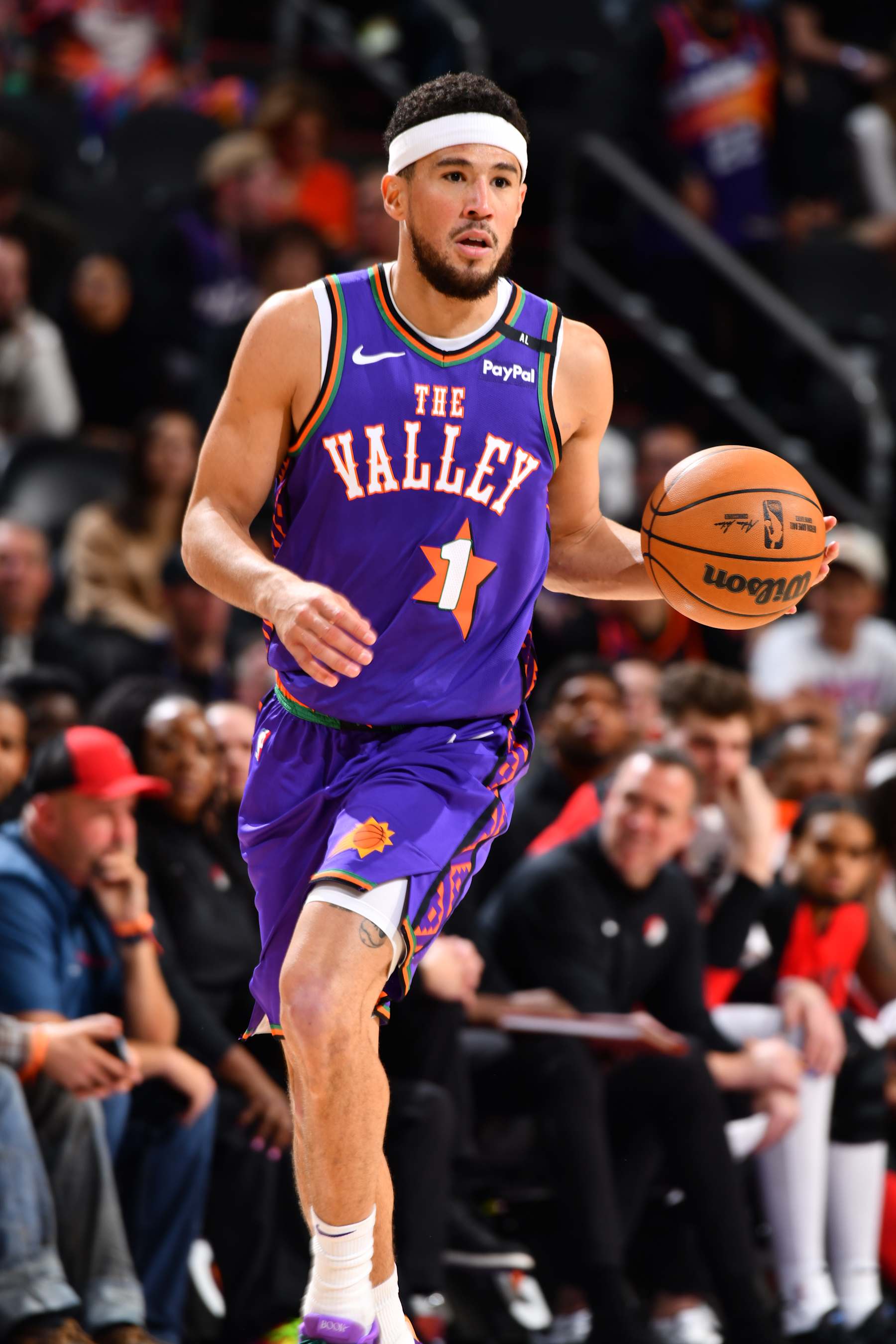 PHOENIX, AZ - DECEMBER 15: Devin Booker #1 of the Phoenix Suns dribbles the ball during the game against the Portland Trail Blazers on December 15, 2024 at Footprint Center in Phoenix, Arizona. NOTE TO USER: User expressly acknowledges and agrees that, by downloading and or using this photograph, user is consenting to the terms and conditions of the Getty Images License Agreement. Mandatory Copyright Notice: Copyright 2024 NBAE (Photo by Barry Gossage/NBAE via Getty Images)