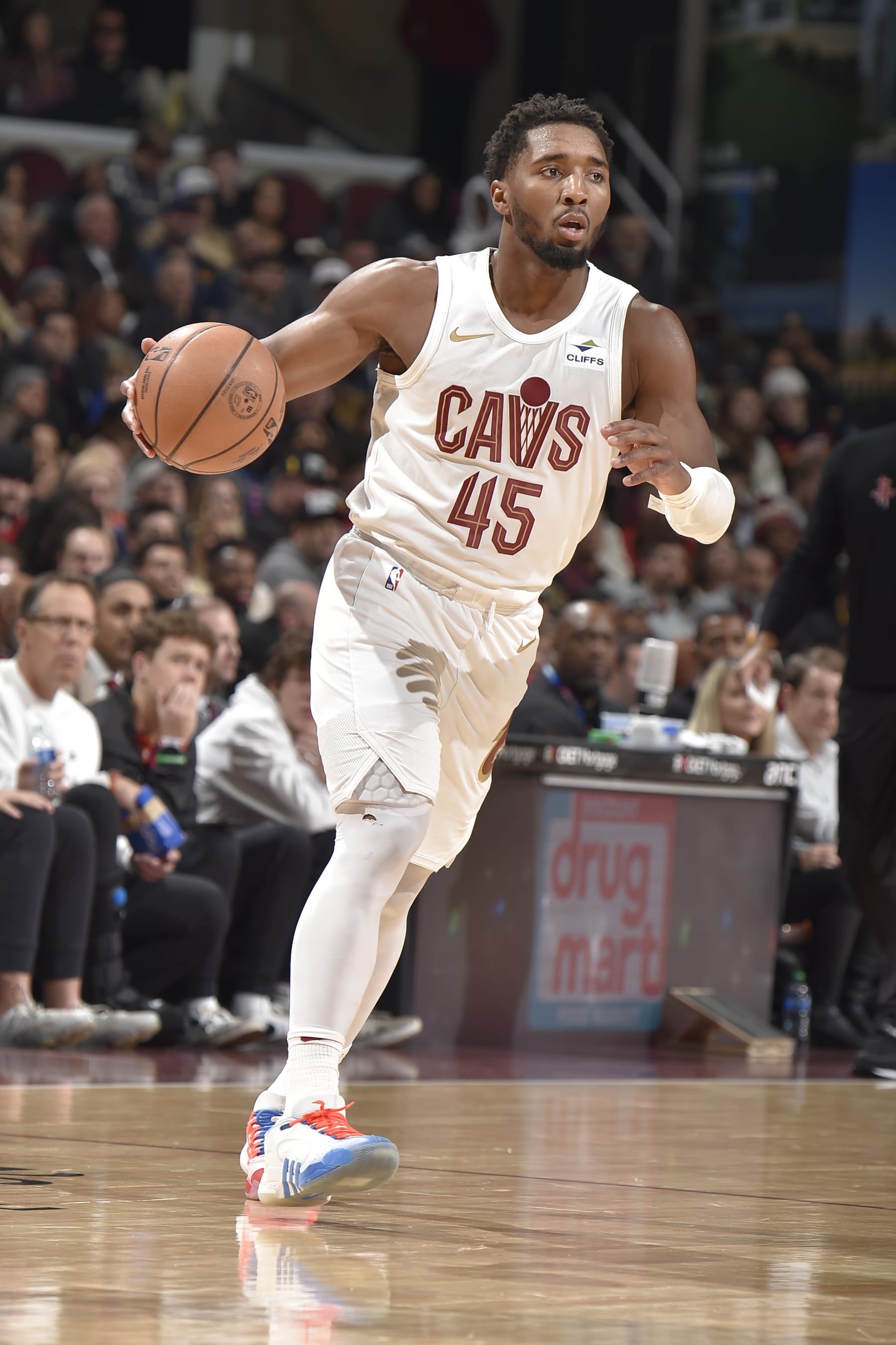 CLEVELAND, OH - DECEMBER 18: Donovan Mitchell #45 of the Cleveland Cavaliers brings the ball up court against the Houston Rockets on December 18, 2023 at Rocket Mortgage FieldHouse in Cleveland, Ohio. NOTE TO USER: User expressly acknowledges and agrees that, by downloading and/or using this Photograph, user is consenting to the terms and conditions of the Getty Images License Agreement. Mandatory Copyright Notice: Copyright 2023 NBAE (Photo by David Liam Kyle/NBAE via Getty Images)