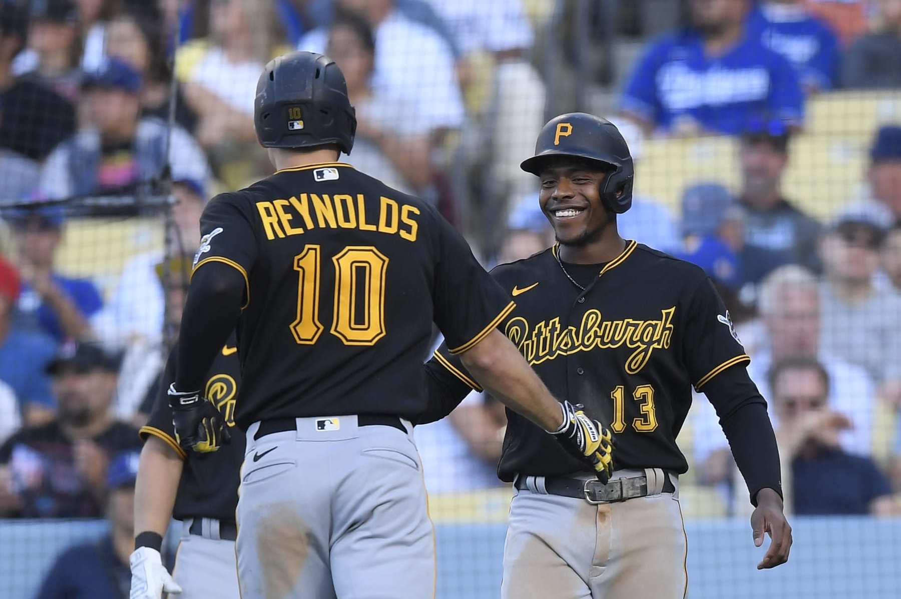 Pittsburgh Pirates left fielder Bryan Reynolds (10) flips his bat after  striking out against the Milwaukee Brewers during the sixth inning of a  baseball game Wednesday, April 20, 2022, in Milwaukee. (AP