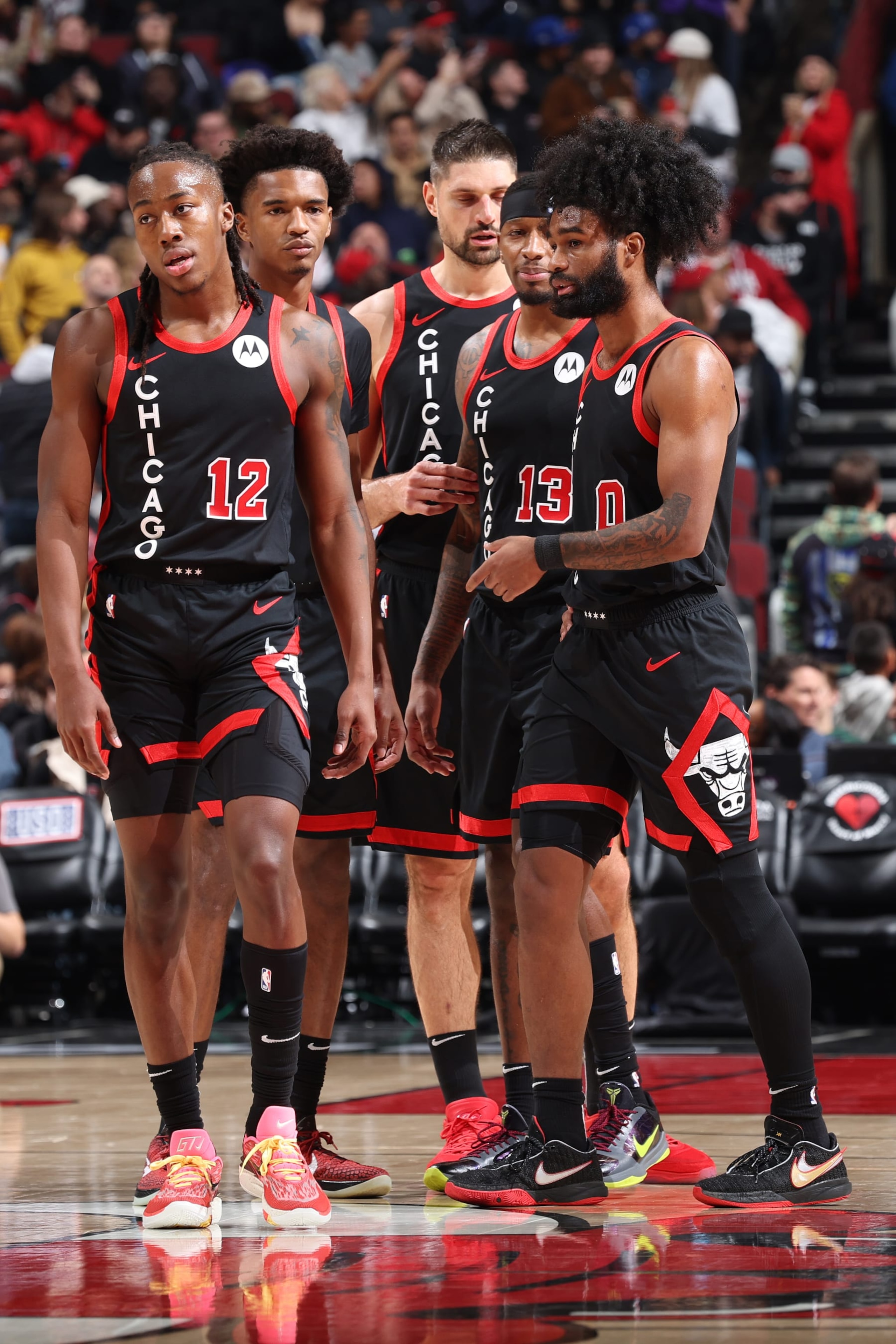 CHICAGO, IL - NOVEMBER 30: Ayo Dosunmu #12 of the Chicago Bulls Julian Phillips #15 of the Chicago Bulls Nikola Vucevic #9 of the Chicago Bulls Torrey Craig #13 of Chicago Bulls & Coby White #0 of the Chicago Bulls looks on during the game on November 30, 2023 at United Center in Chicago, Illinois. NOTE TO USER: User expressly acknowledges and agrees that, by downloading and or using this photograph, User is consenting to the terms and conditions of the Getty Images License Agreement. Mandatory Copyright Notice: Copyright 2023 NBAE (Photo by Jeff Haynes/NBAE via Getty Images) CHICAGO, IL - NOVEMBER 30: Ayo Dosunmu #12 of the Chicago Bulls Julian Phillips #15 of the Chicago Bulls Nikola Vucevic #9 of the Chicago Bulls Torrey Craig #13 of Chicago Bulls & Coby White #0 of the Chicago Bulls looks on during the game on November 30, 2023 at United Center in Chicago, Illinois. NOTE TO USER: User expressly acknowledges and agrees that, by downloading and or using this photograph, User is consenting to the terms and conditions of the Getty Images License Agreement. Mandatory Copyright Notice: Copyright 2023 NBAE (Photo by Jeff Haynes/NBAE via Getty Images)