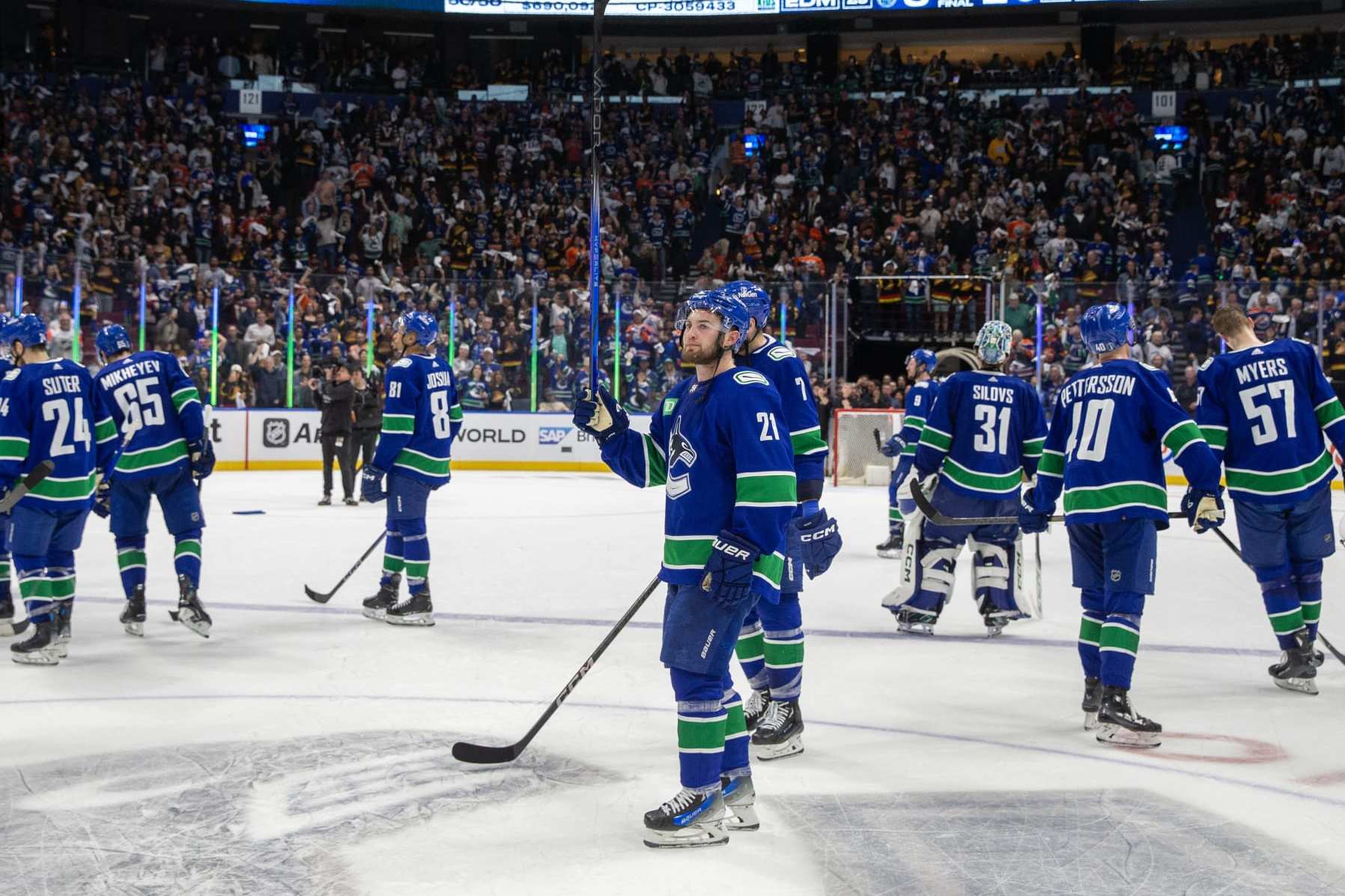 VANCOUVER, CANADA - MAY 20: Nils Hoglander #21 of the Vancouver Canucks waves in appreciation to fans after Game Seven of the Second Round of the 2024 Stanley Cup Playoffs loss against the Edmonton Oilers at Rogers Arena on May 20, 2024 in Vancouver, British Columbia, Canada. Edmonton won 3-2 (Photo by Jeff Vinnick/NHLI via Getty Images)