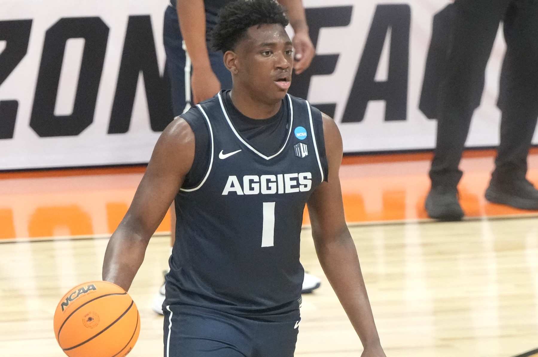 INDIANAPOLIS, INDIANA - MARCH 24:  Great Osobor #1 of the Utah State Aggies dribbles the ball during the NCAA Men's Basketball Tournament - Second Round game against the Purdue Boilermakers at Gainbridge Fieldhouse on March 24, 2024 in Indianapolis, Indiana.  (Photo by Mitchell Layton/Getty Images)