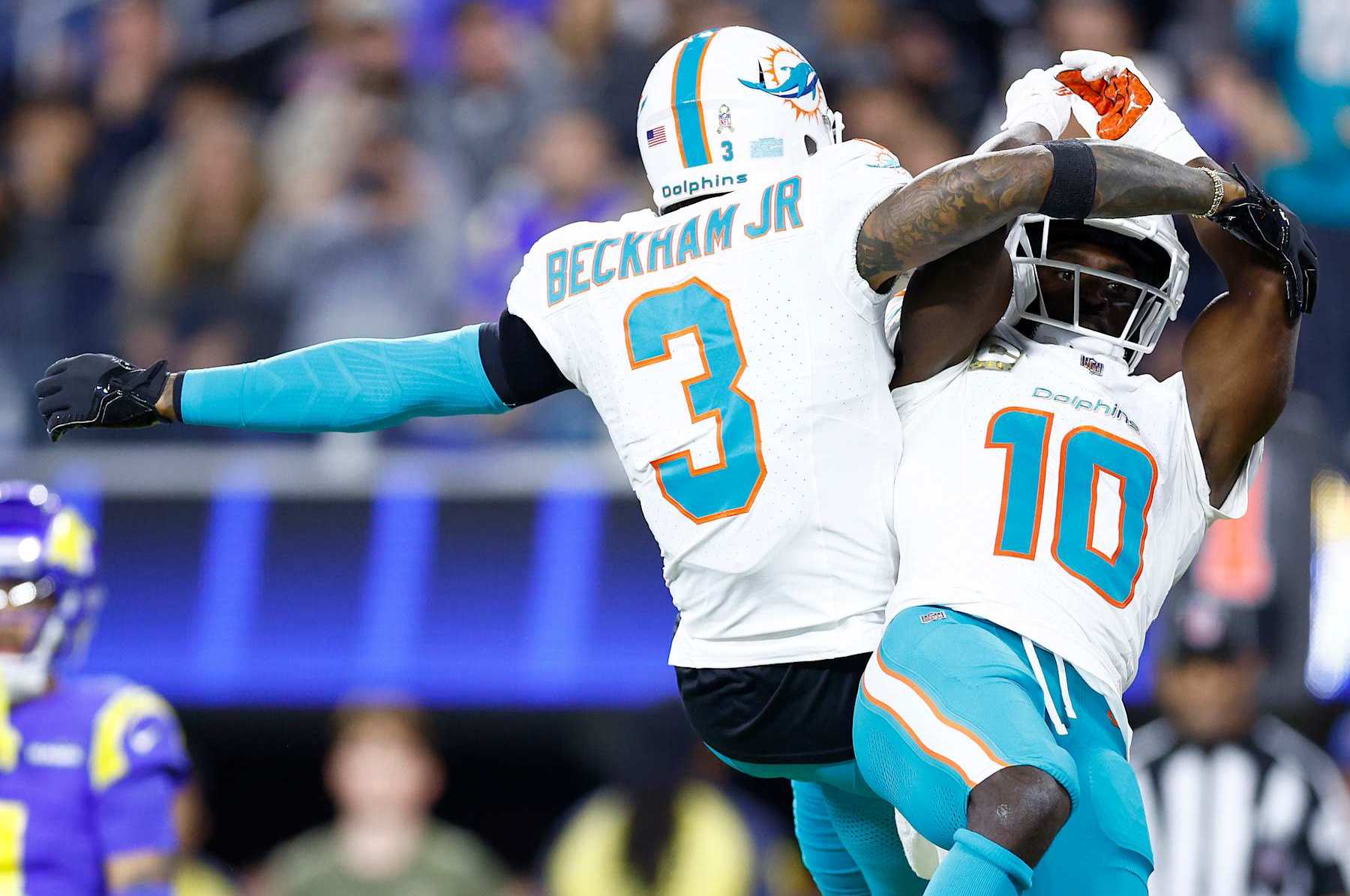 INGLEWOOD, CALIFORNIA - NOVEMBER 11: Tyreek Hill #10 of the Miami Dolphins celebrates with Odell Beckham Jr. #3 after scoring a touchdown against the Los Angeles Rams during the third quarter in the game at SoFi Stadium on November 11, 2024 in Inglewood, California. (Photo by Ronald Martinez/Getty Images)