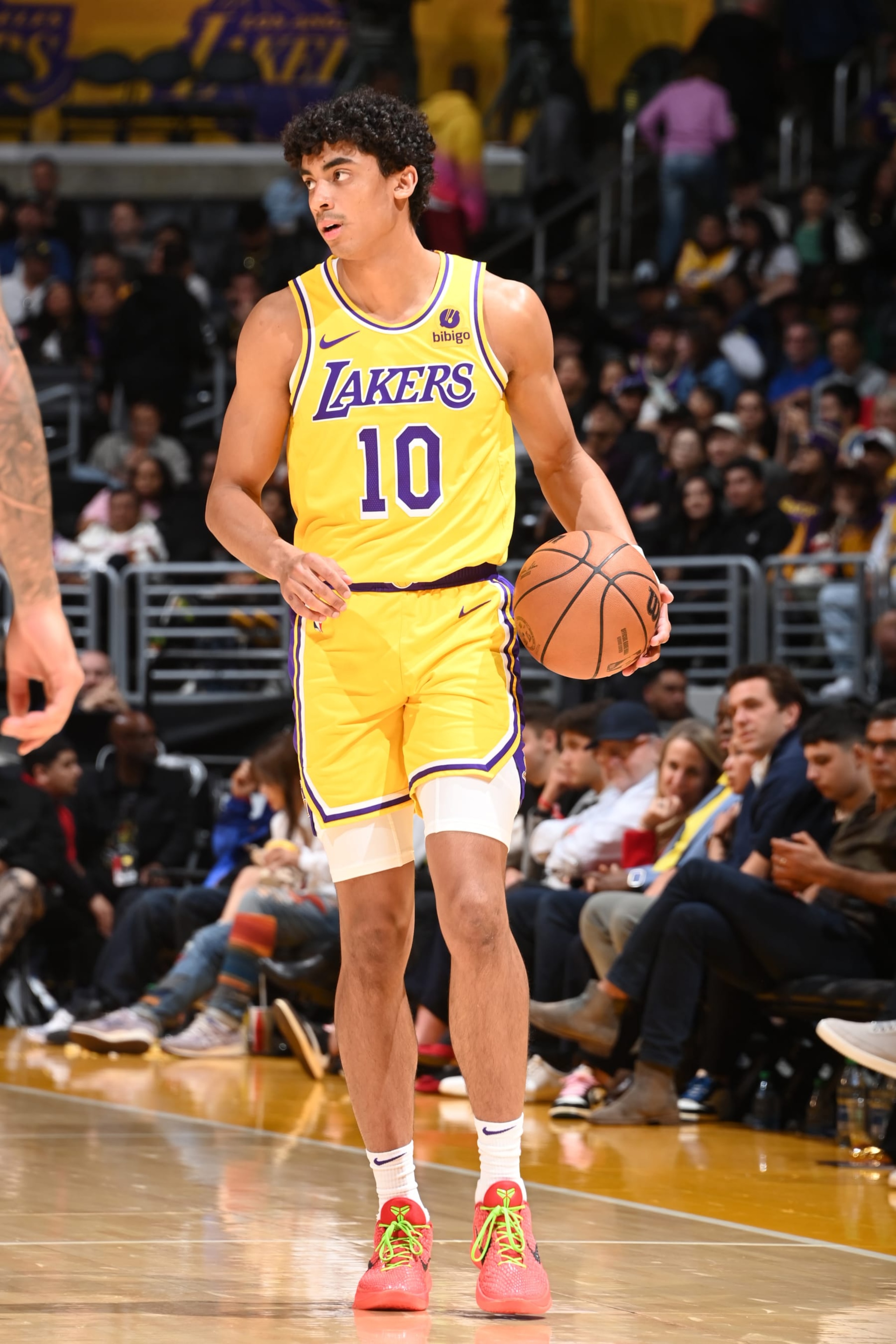 LOS ANGELES, CA - APRIL 9: Max Christie #10 of the Los Angeles Lakers dribbles the ball during the game against the Golden State Warriors on April 9, 2024 at Crypto.Com Arena in Los Angeles, California. NOTE TO USER: User expressly acknowledges and agrees that, by downloading and/or using this Photograph, user is consenting to the terms and conditions of the Getty Images License Agreement. Mandatory Copyright Notice: Copyright 2024 NBAE (Photo by Andrew D. Bernstein/NBAE via Getty Images)