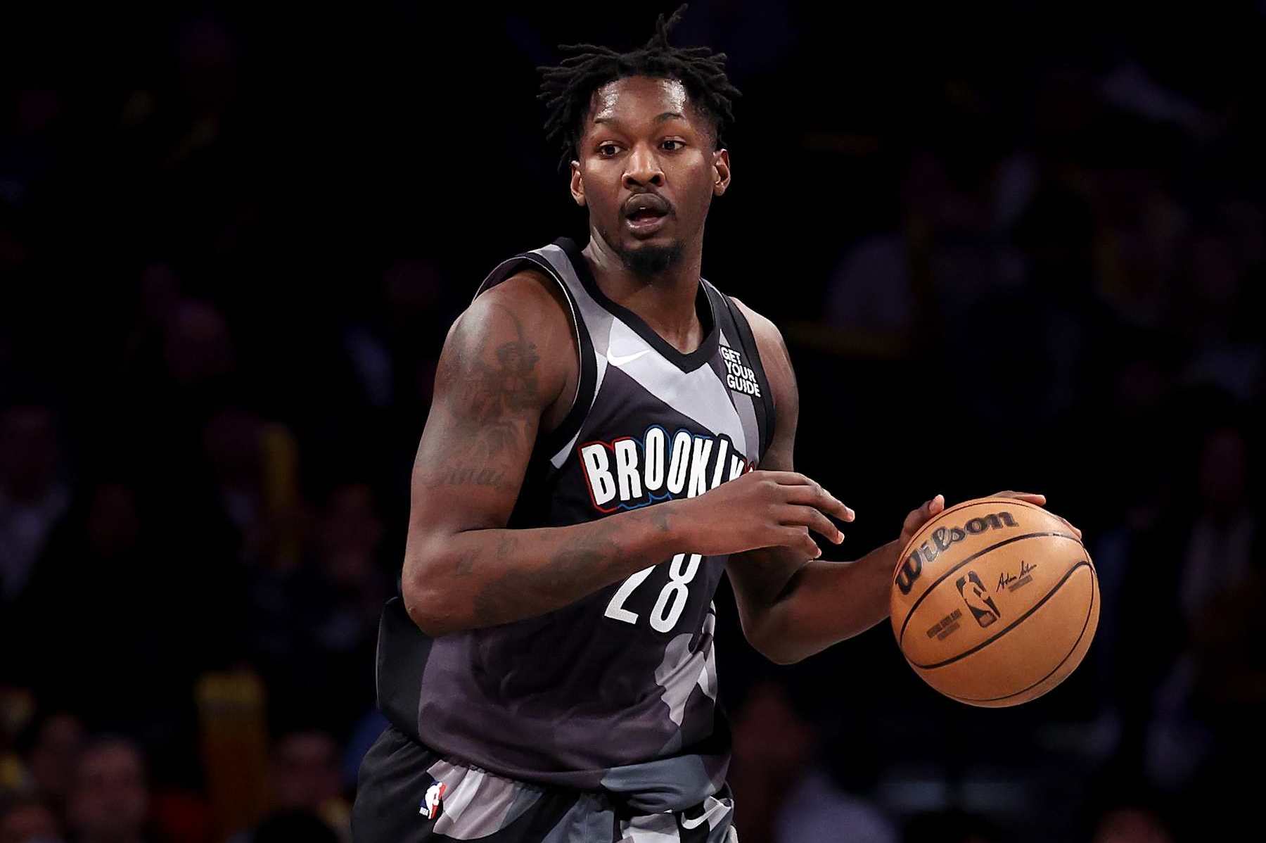 NEW YORK, NEW YORK - DECEMBER 27: Dorian Finney-Smith #28 of the Brooklyn Nets dribbles the ball against the San Antonio Spurs during the second half at Barclays Center on December 27, 2024 in New York City. NOTE TO USER: User expressly acknowledges and agrees that, by downloading and or using this photograph, User is consenting to the terms and conditions of the Getty Images License Agreement.  (Photo by Luke Hales/Getty Images)