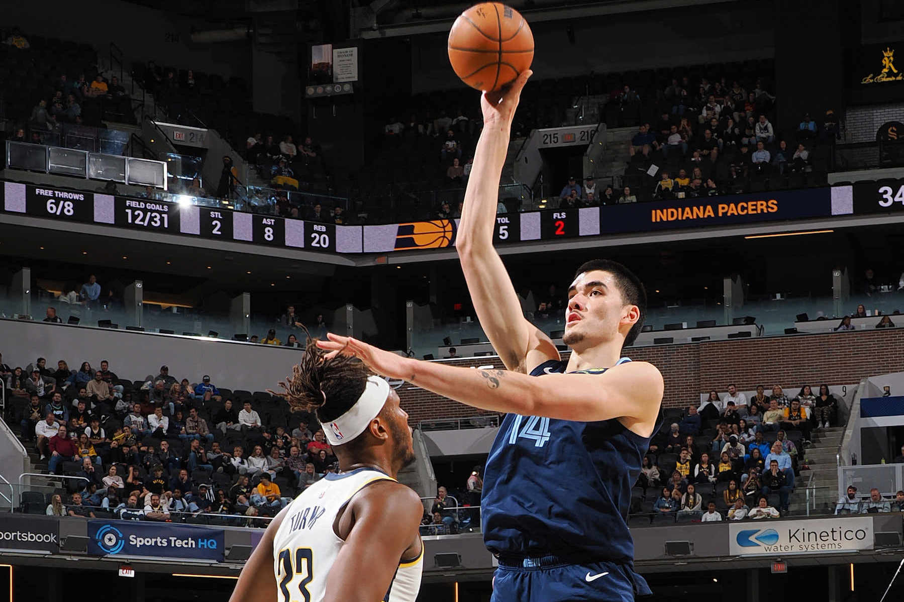 INDIANAPOLIS, IN - OCTOBER 14: Zach Edey #14 of the Memphis Grizzlies shoots the ball during the game against the Indiana Pacers during a preseason game on October 14, 2024 at Gainbridge Fieldhouse in Indianapolis, Indiana. NOTE TO USER: User expressly acknowledges and agrees that, by downloading and or using this Photograph, user is consenting to the terms and conditions of the Getty Images License Agreement. Mandatory Copyright Notice: Copyright 2024 NBAE (Photo by Ron Hoskins/NBAE via Getty Images)
