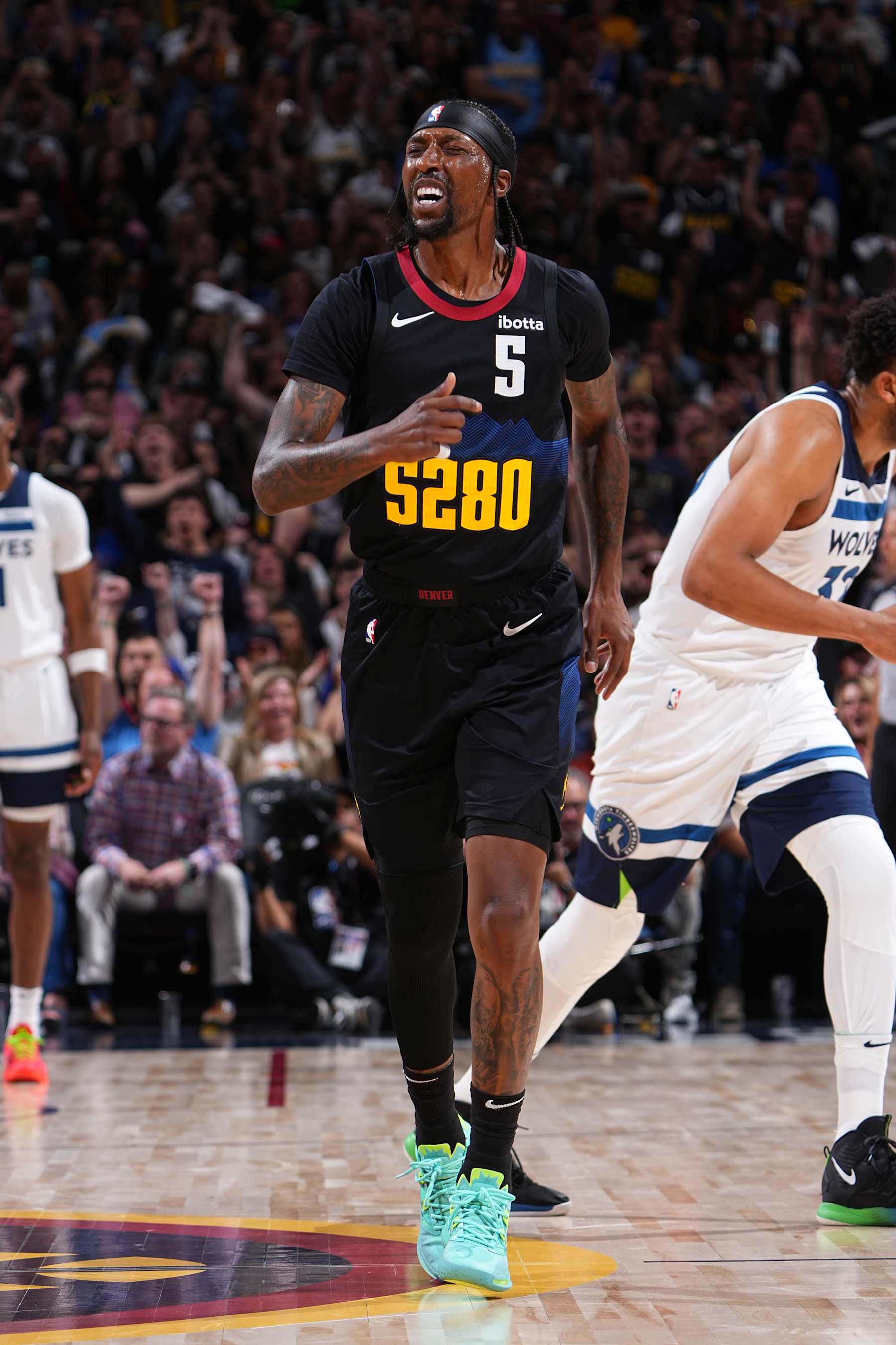 DENVER, CO - MAY 14: Kentavious Caldwell-Pope #5 of the Denver Nuggets celebrates during the game against the Minnesota Timberwolves during Round 2 Game 5 of the of the 2024 NBA Playoffs on May 14, 2024 at the Ball Arena in Denver, Colorado. NOTE TO USER: User expressly acknowledges and agrees that, by downloading and/or using this Photograph, user is consenting to the terms and conditions of the Getty Images License Agreement. Mandatory Copyright Notice: Copyright 2024 NBAE (Photo by Garrett Ellwood/NBAE via Getty Images)