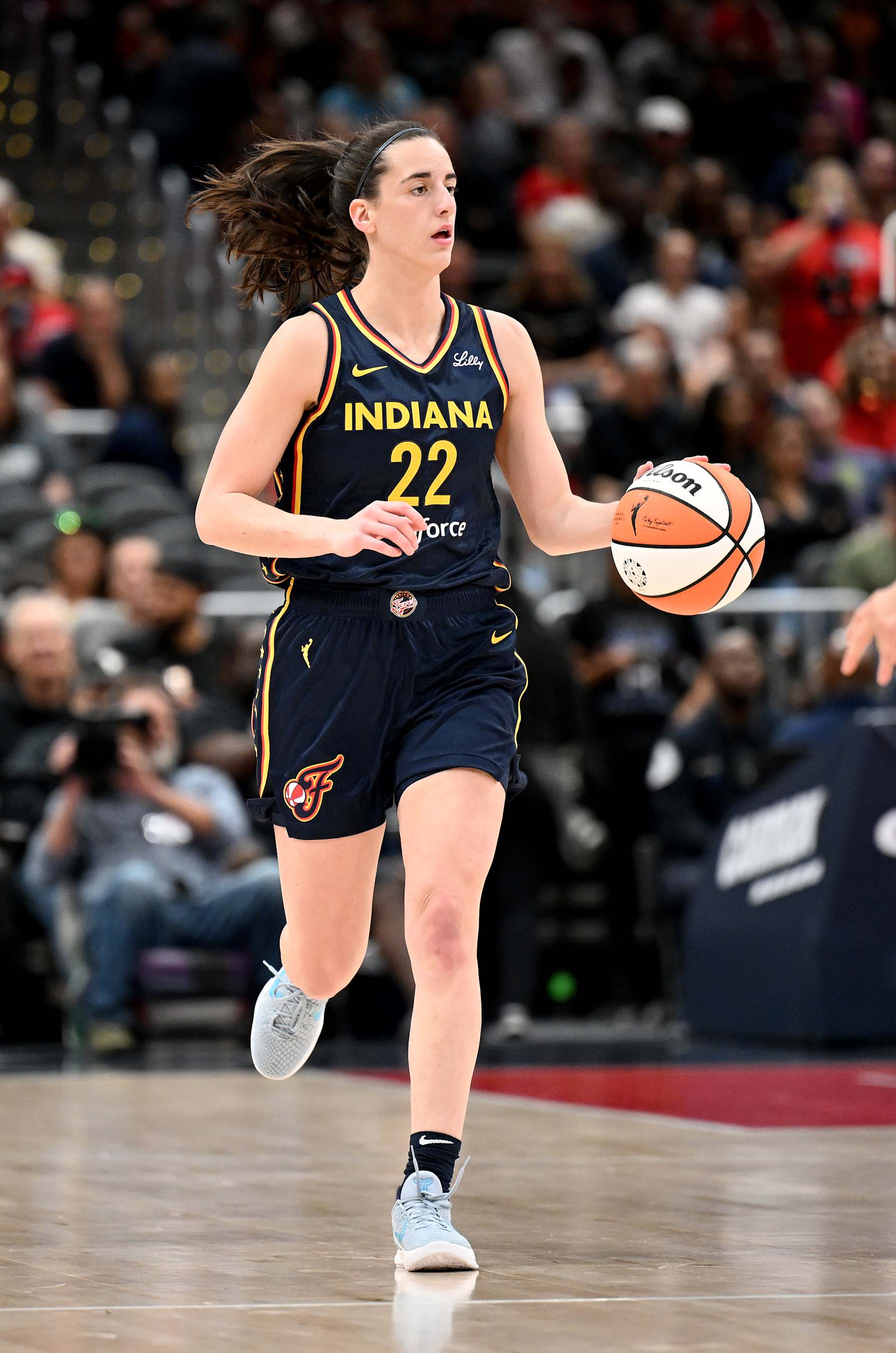 WASHINGTON, DC - SEPTEMBER 19: Caitlin Clark #22 of the Indiana Fever handles the ball in the first quarter against the Washington Mystics at Capital One Arena on September 19, 2024 in Washington, DC.  NOTE TO USER: User expressly acknowledges and agrees that, by downloading and or using this photograph, User is consenting to the terms and conditions of the Getty Images License Agreement. (Photo by Greg Fiume/Getty Images)
