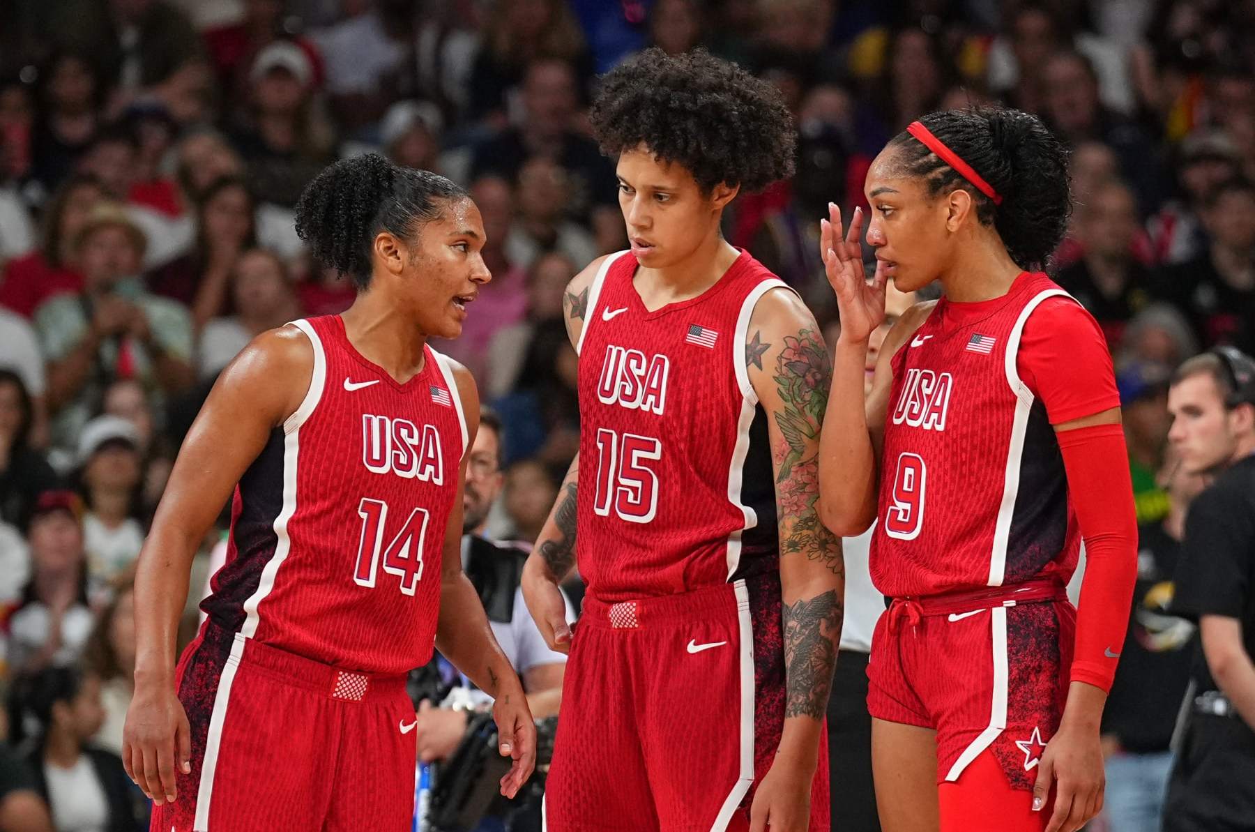 LILLE, FRANCE - AUGUST 4: Alyssa Thomas #14 of Team USA Brittney Griner #15 of Team USA and A'ja Wilson #9 of Team USA looks on during the game at the Stade Pierre Mauroy on August 4, 2024 in Lille, France. NOTE TO USER: User expressly acknowledges and agrees that, by downloading and/or using this photograph, user is consenting to the terms and conditions of the Getty Images License Agreement. Mandatory Copyright Notice: Copyright 2024 NBAE (Photo by Garrett W. Ellwood/NBAE via Getty Images)