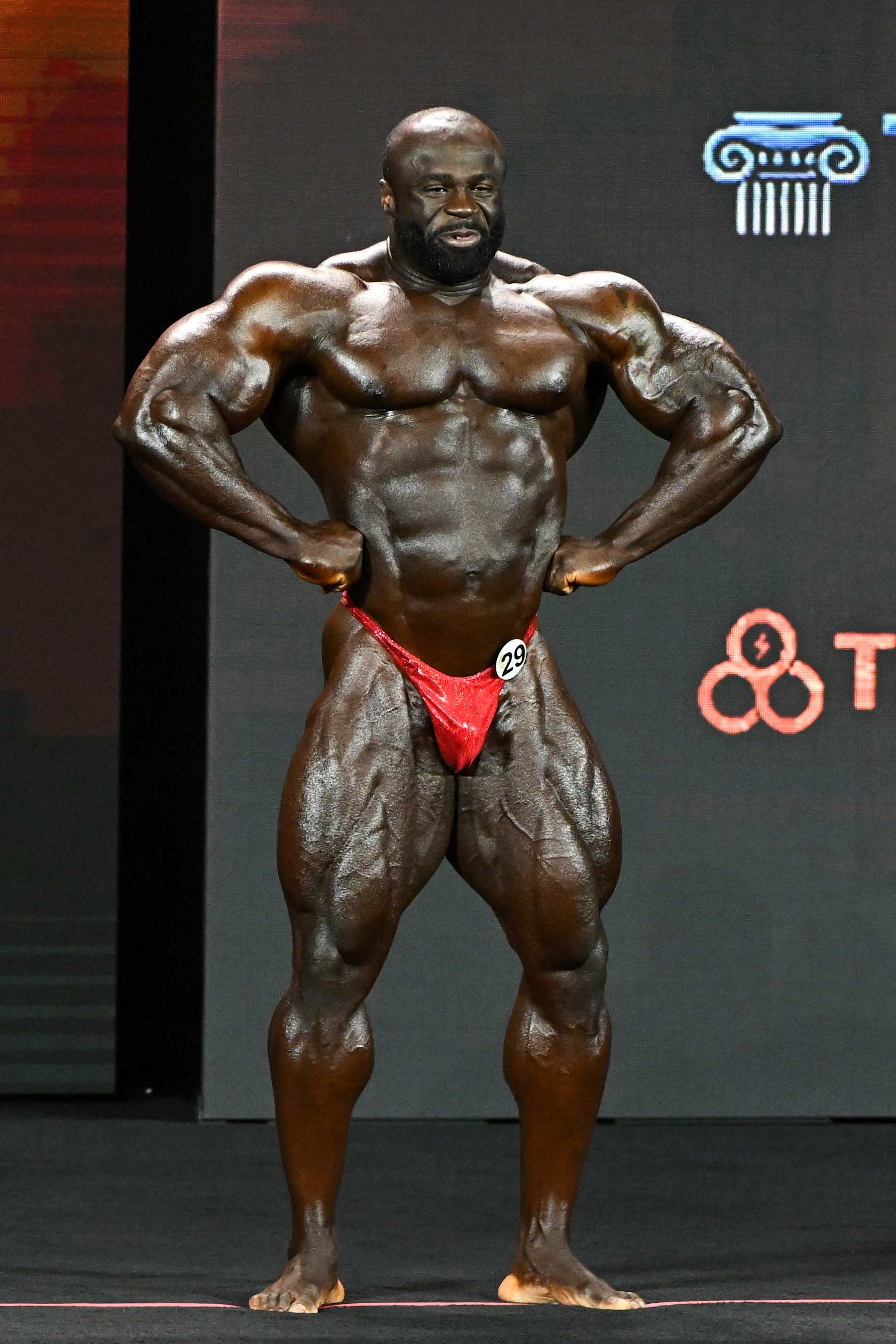 LAS VEGAS, NEVADA - DECEMBER 17, 2022: Samson Dauda competes in the Mr. Olympia event during the Olympia Fitness & Performance weekend at Planet Hollywood Resort and Casino on December 17, 2022 in Las Vegas, Nevada. (Photo by Chris Bernacchi/Diamond Images via Getty Images)