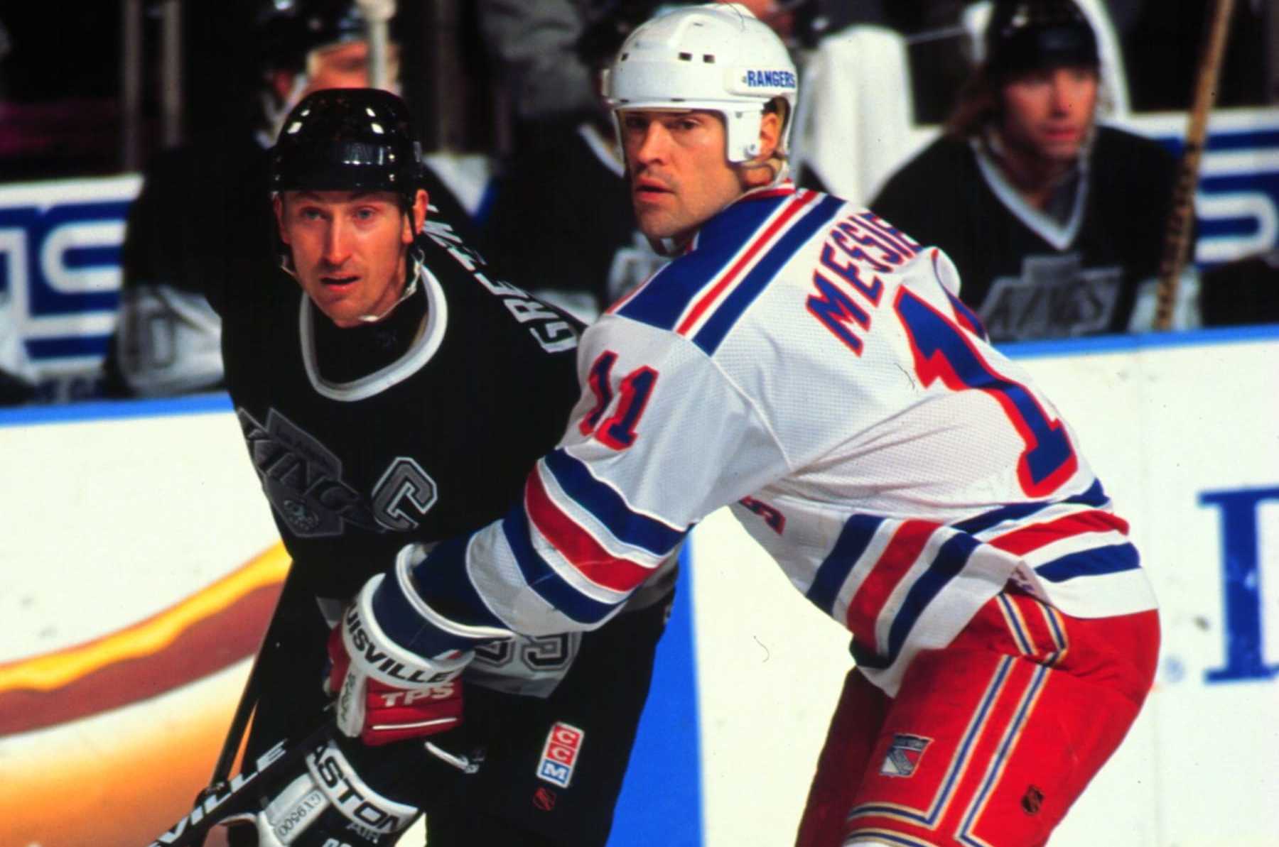 2000 Season: Ranger captain Mark Messier keeps a close watch on Wayne Gretzky.  (Photo by Bruce Bennett Studios via Getty Images Studios/Getty Images)