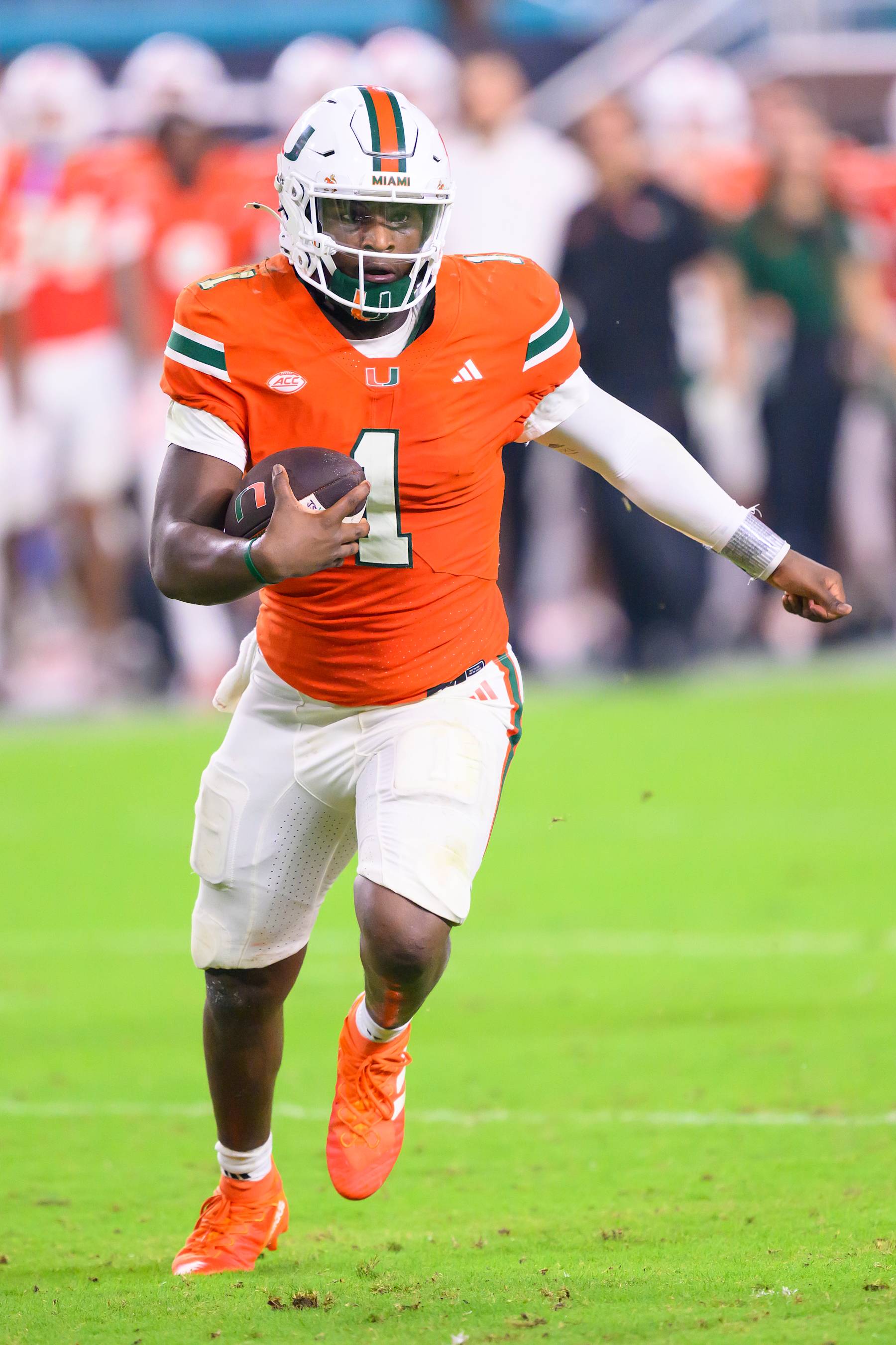 MIAMI GARDENS, FL - SEPTEMBER 27: Miami quarterback Cam Ward (1) runs with the ball during the college football game between the Virginia Tech Hokies and the University of Miami Hurricanes on September 27, 2024 at the Hard Rock Stadium in Miami Gardens, FL. (Photo by Doug Murray/Icon Sportswire via Getty Images)