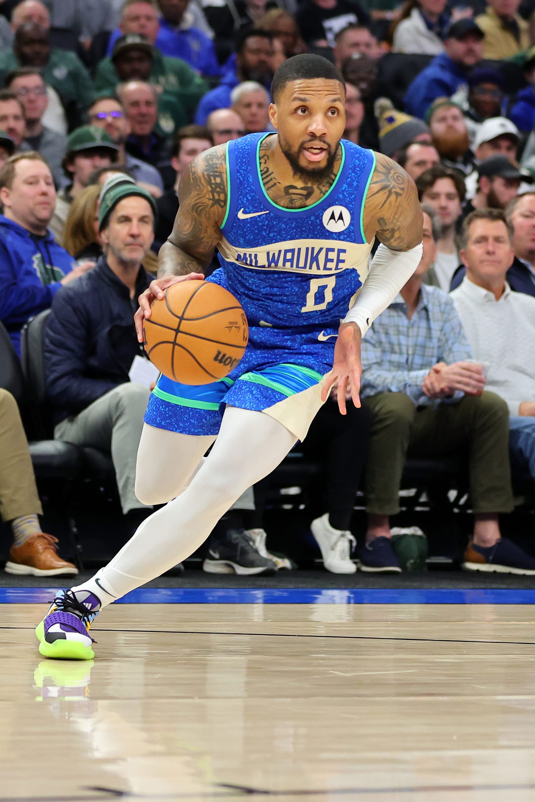 MILWAUKEE, WISCONSIN - FEBRUARY 12: Damian Lillard #0 of the Milwaukee Bucks handles the ball during a game against the Denver Nuggets at Fiserv Forum on February 12, 2024 in Milwaukee, Wisconsin. NOTE TO USER: User expressly acknowledges and agrees that, by downloading and or using this photograph, User is consenting to the terms and conditions of the Getty Images License Agreement. (Photo by Stacy Revere/Getty Images)