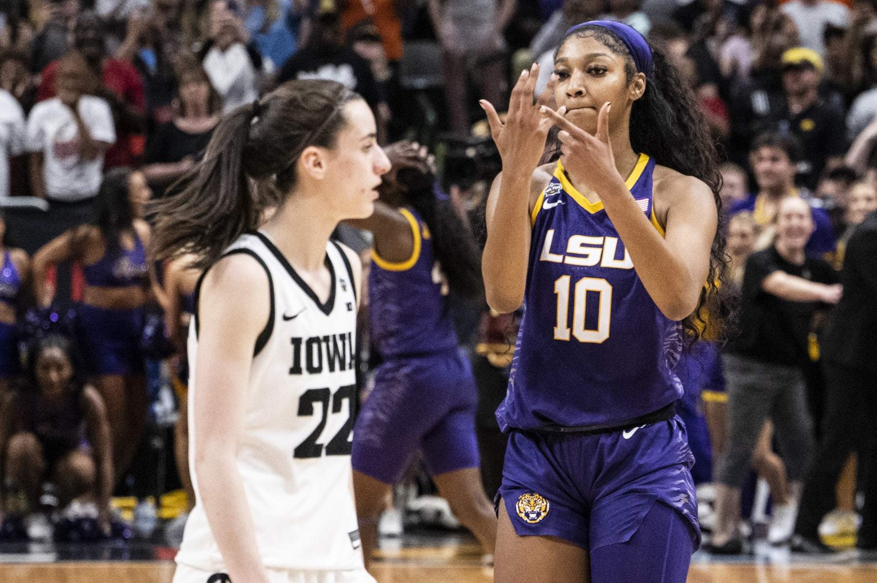 DALLAS, TEXAS - APRIL 02: Angel Reese #10 of the LSU Lady Tigers reacts in front of Caitlin Clark #22 of the Iowa Hawkeyes towards the end of the 2023 NCAA Women's Basketball Tournament championship game at American Airlines Center on April 02, 2023 in Dallas, Texas. (Photo by Ben Solomon/NCAA Photos via Getty Images)