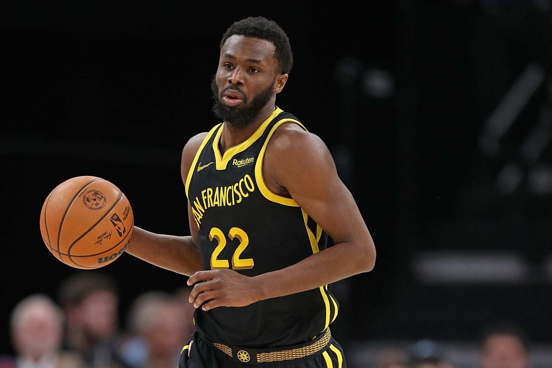 MEMPHIS, TENNESSEE - JANUARY 15: Andrew Wiggins #22 of the Golden State Warriors brings the ball down court during the game against the Memphis Grizzlies at FedExForum on January 15, 2024 in Memphis, Tennessee. NOTE TO USER: User expressly acknowledges and agrees that, by downloading and or using this photograph, User is consenting to the terms and conditions of the Getty Images License Agreement. (Photo by Justin Ford/Getty Images)