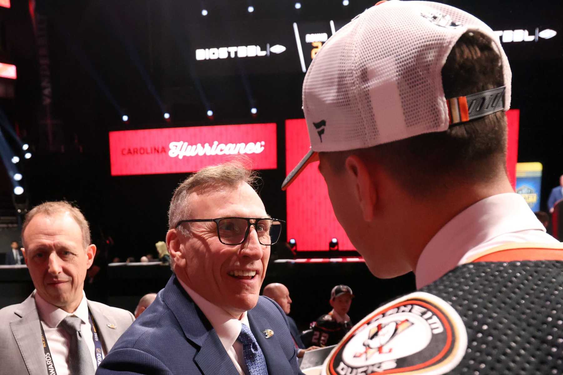 NASHVILLE, TENNESSEE - JUNE 29: Carey Terrance (R) shakes hands with general manager Pat Verbeek stage after being selected 59th overall by the Anaheim Ducks during the 2023 Upper Deck NHL Draft at Bridgestone Arena on June 29, 2023 in Nashville, Tennessee. (Photo by Dave Sandford/NHLI via Getty Images)