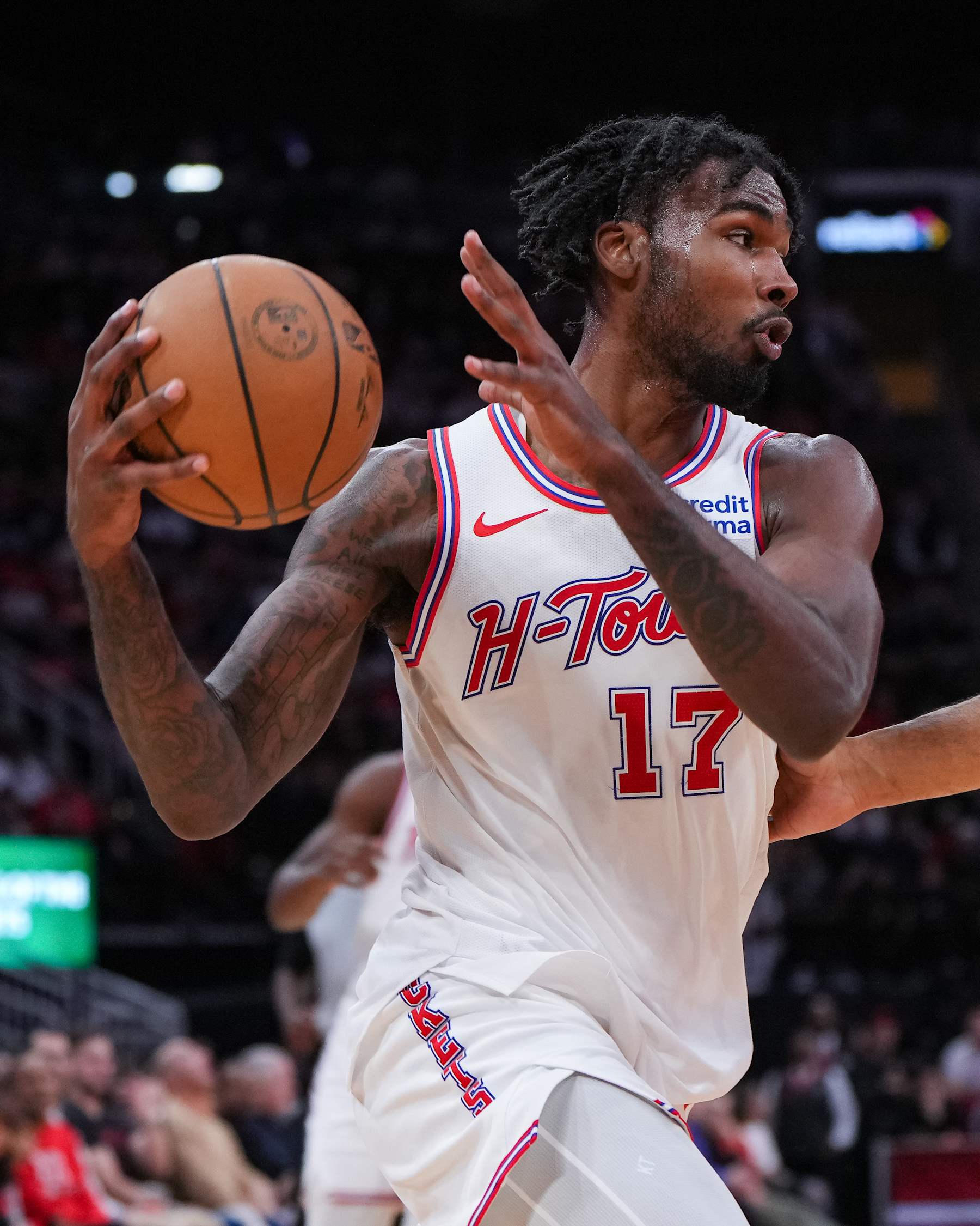 HOUSTON, TEXAS - DECEMBER 27: Tari Eason #17 of the Houston Rockets holds the ball during the third quarter of the game against the Phoenix Suns at Toyota Center on December 27, 2023 in Houston, Texas. User expressly acknowledges and agrees that, by downloading and or using this photograph, User is consenting to the terms and conditions of the Getty Images License Agreement. (Photo by Alex Bierens de Haan/Getty Images)