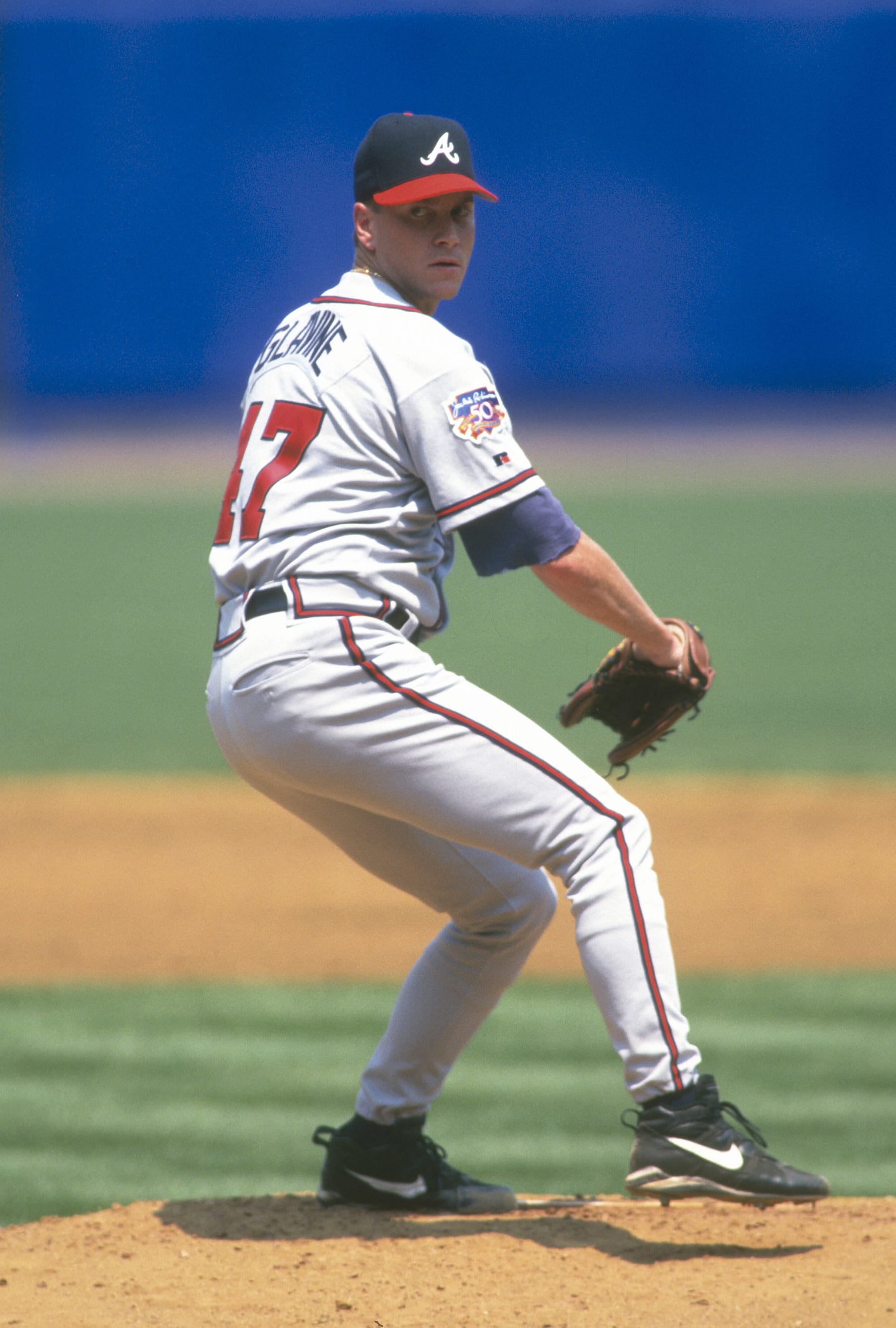 NEW YORK - CIRCA 1997: Tom Glavine #47 of the Atlanta Braves pitches against the New York Mets during a Major League Baseball game circa 1997 at Shea Stadium in the Queens borough of New York City. Glavine played for the Braves from 1987-2002 and 2008. (Photo by Focus on Sport/Getty Images) 