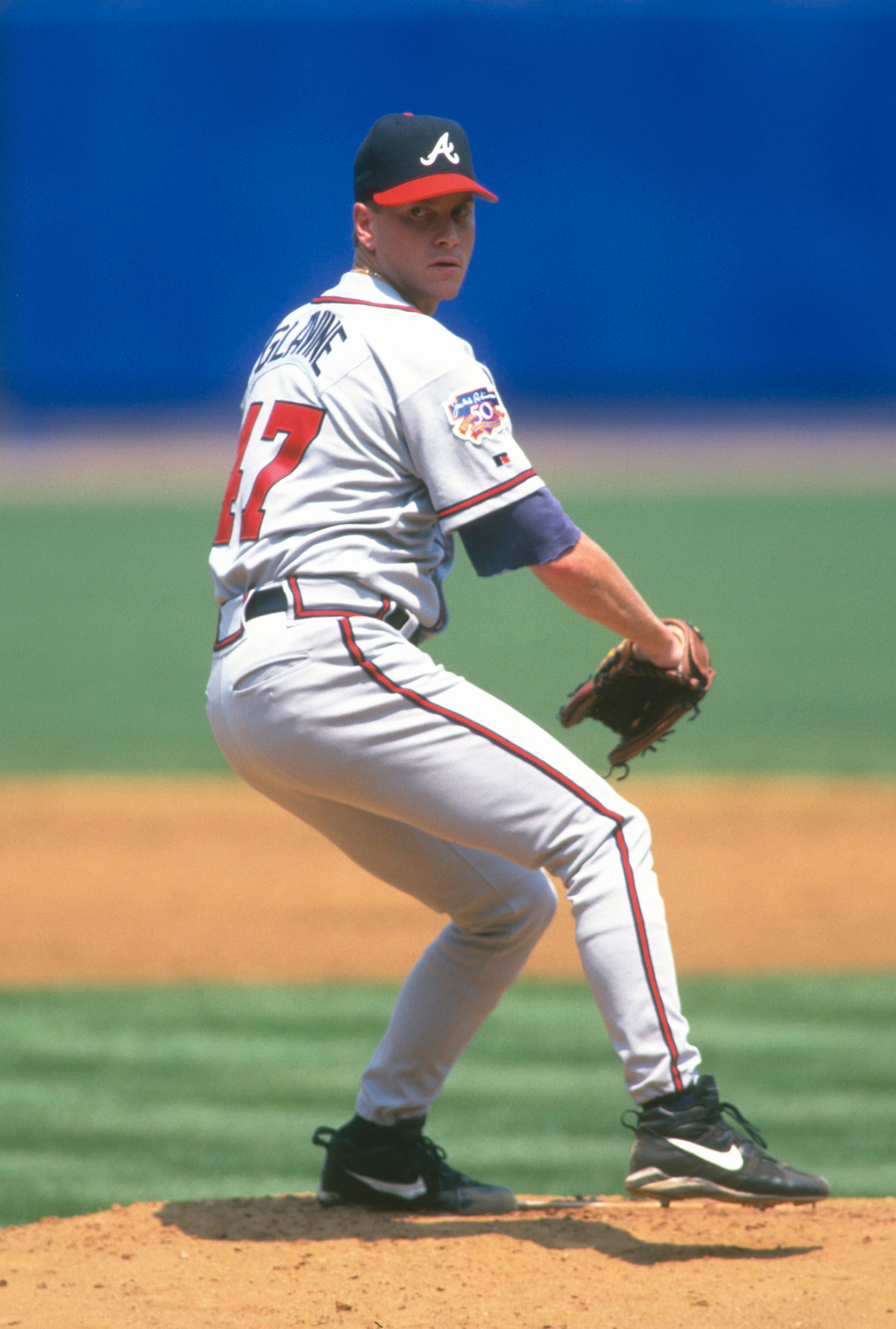 NEW YORK - CIRCA 1997: Tom Glavine #47 of the Atlanta Braves pitches against the New York Mets during a Major League Baseball game circa 1997 at Shea Stadium in the Queens borough of New York City. Glavine played for the Braves from 1987-2002 and 2008. (Photo by Focus on Sport/Getty Images) 