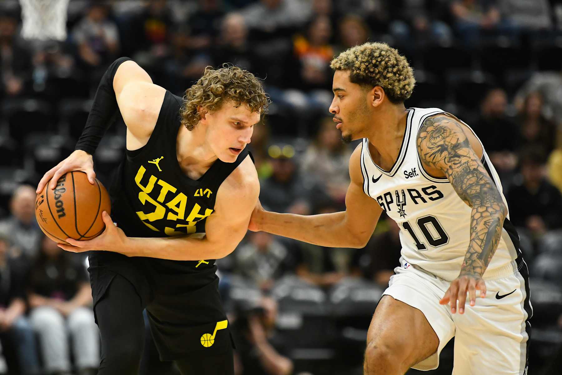SALT LAKE CITY, UTAH - MARCH 27: Lauri Markkanen #23 of the Utah Jazz in action with Jeremy Sochan #10 of the San Antonio Spurs during the first half of a game at Delta Center on March 27, 2024 in Salt Lake City, Utah. NOTE TO USER: User expressly acknowledges and agrees that, by downloading and or using this photograph, User is consenting to the terms and conditions of the Getty Images License Agreement. (Photo by Alex Goodlett/Getty Images)