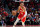 ATLANTA, GA - APRIL 22: Trae Young #11 of the Atlanta Hawks dribbles the ball during the game against the Miami Heat during Round 1 Game 3 of the NBA Playoffs on April 22, 2022 at State Farm Arena in Atlanta, Georgia.  NOTE TO USER: User expressly acknowledges and agrees that, by downloading and/or using this Photograph, user is consenting to the terms and conditions of the Getty Images License Agreement. Mandatory Copyright Notice: Copyright 2022 NBAE (Photo by Scott Cunningham/NBAE via Getty Images)