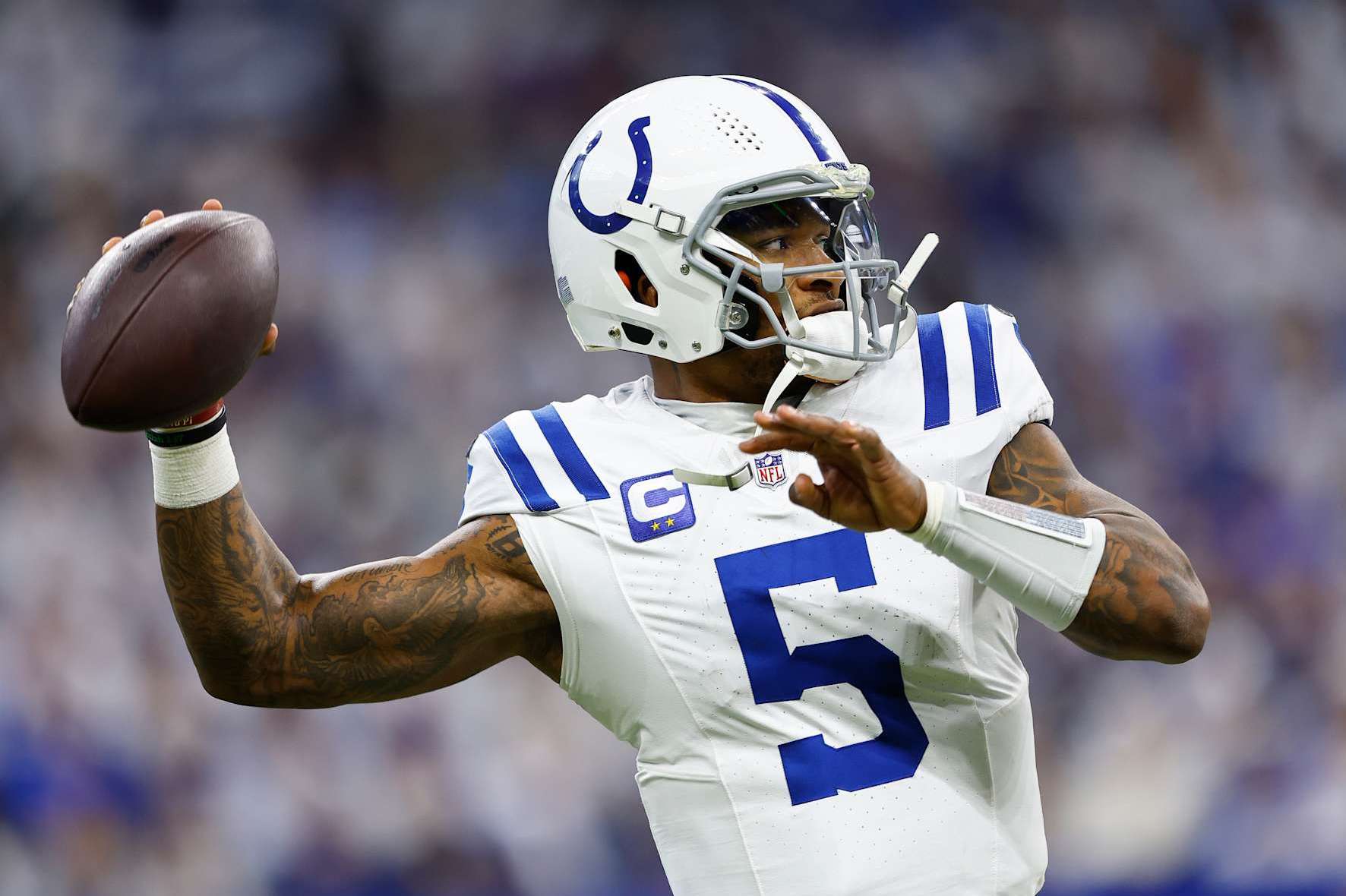 INDIANAPOLIS, IN - DECEMBER 22: Indianapolis Colts quarterback Anthony Richardson (5) warms up on the side line during a NFL game between the Tennessee Titans and the Indianapolis Colts on December 22, 2024 at Lucas Oil Stadium in Indianapolis, IN.  (Photo by Jeffrey Brown/Icon Sportswire via Getty Images)