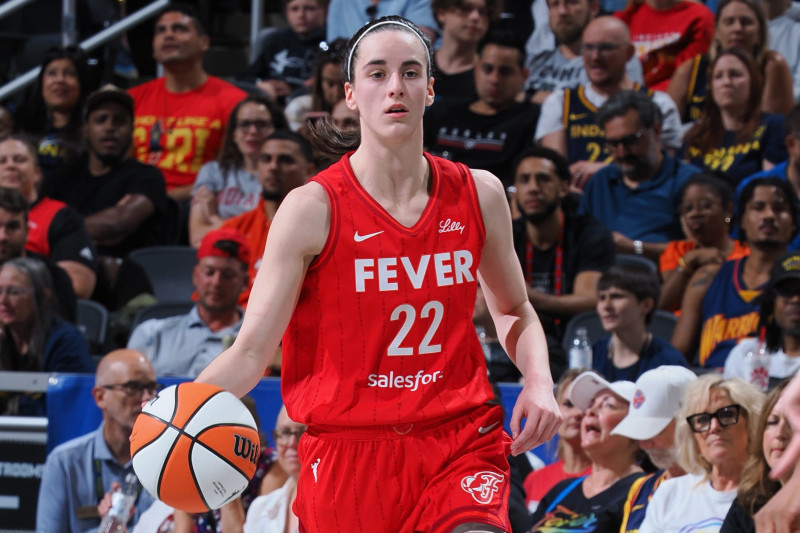 INDIANAPOLIS, IN - JULY 6: Caitlin Clark #22 of the Indiana Fever dribbles the ball during the game against the New York Liberty on July 6, 2024 at Gainbridge Fieldhouse in Indianapolis, Indiana. NOTE TO USER: User expressly acknowledges and agrees that, by downloading and or using this Photograph, user is consenting to the terms and conditions of the Getty Images License Agreement. Mandatory Copyright Notice: Copyright 2024 NBAE (Photo by Ron Hoskins/NBAE via Getty Images)