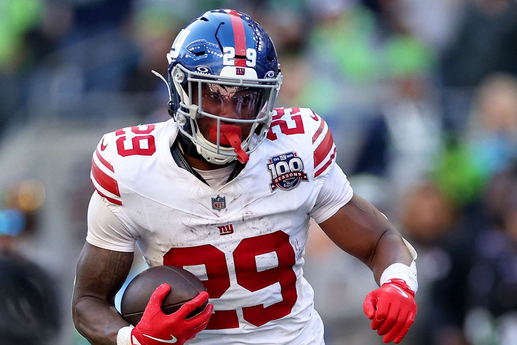 SEATTLE, WASHINGTON - OCTOBER 06: Tyrone Tracy Jr. #29 of the New York Giants carries the ball against the Seattle Seahawks at Lumen Field on October 06, 2024 in Seattle, Washington. (Photo by Steph Chambers/Getty Images)