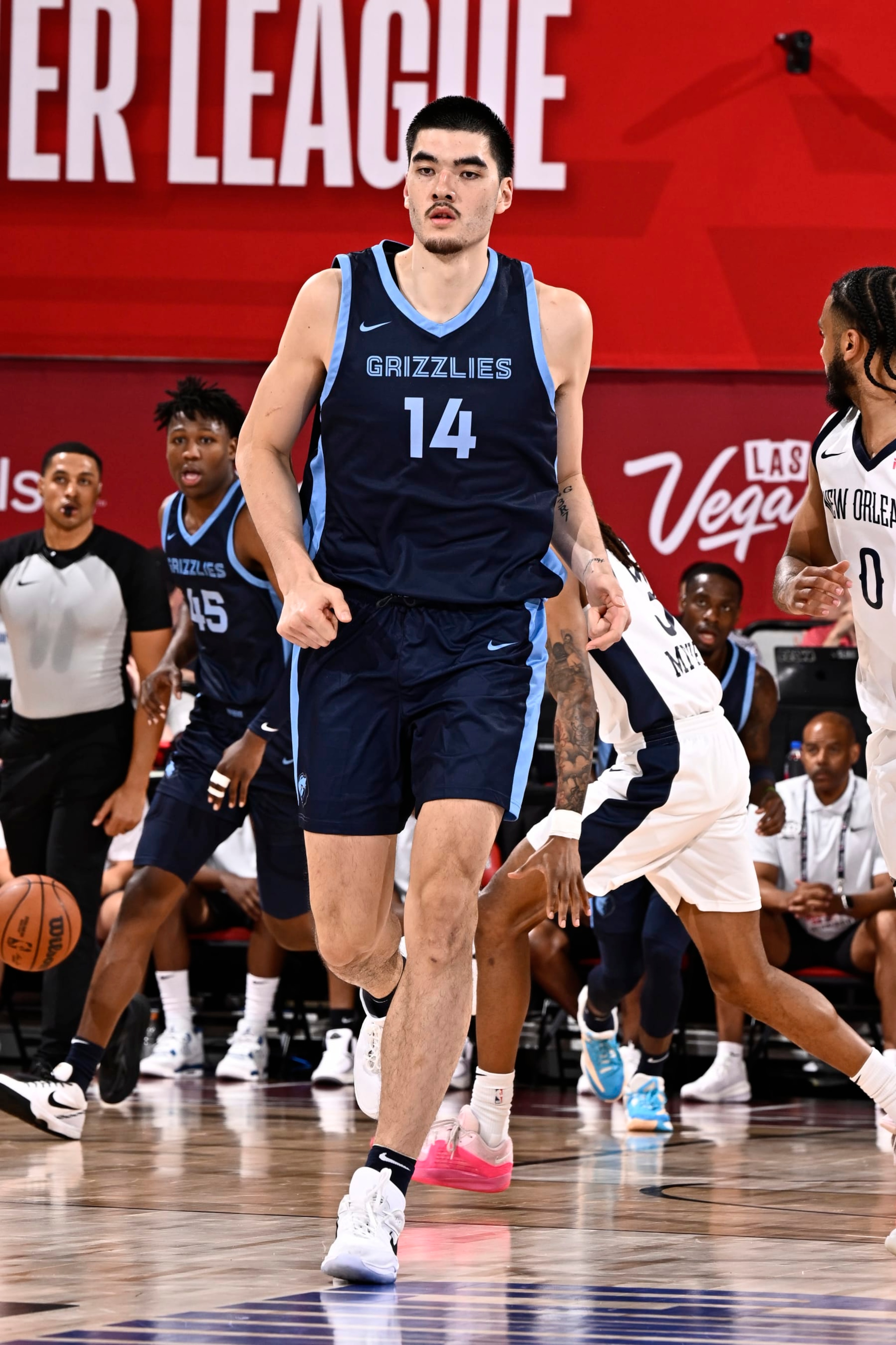 LAS VEGAS, NV - JULY 18: Zach Edey #14 of the Memphis Grizzlies looks on during the game against the New Orleans Pelicans on July 18, 2024 at the Cox Pavilion in Las Vegas, Nevada. NOTE TO USER: User expressly acknowledges and agrees that, by downloading and or using this photograph, User is consenting to the terms and conditions of the Getty Images License Agreement. Mandatory Copyright Notice: Copyright 2024 NBAE (Photo by David Dow/NBAE via Getty Images)