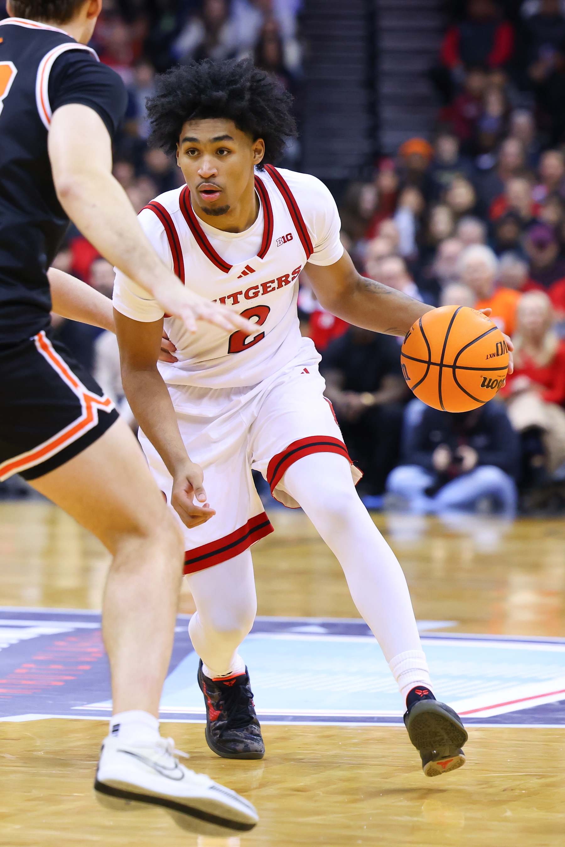 NEWARK, NJ - DECEMBER 21:  Dylan Harper #2 of the Rutgers Scarlet Knights controls the ball during the second half of the Never Forget Tribute Classic game against the Princeton Tigers on December 21, 2024 at the Prudential Center in Newark, New Jersey.  (Photo by Rich Graessle/Icon Sportswire via Getty Images)