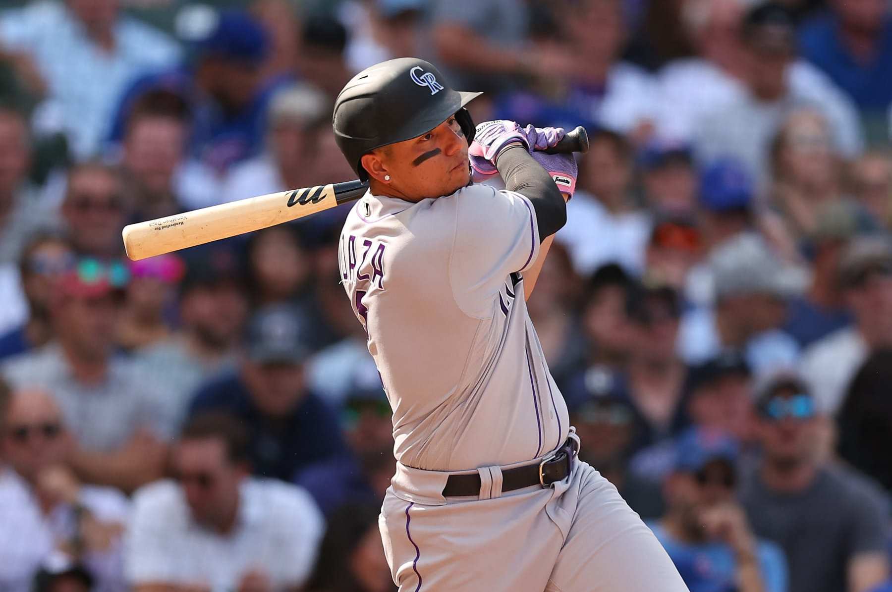 CHICAGO, ILLINOIS - SEPTEMBER 16: Yonathan Daza #2 of the Colorado Rockies at bat against the Chicago Cubs at Wrigley Field on September 16, 2022 in Chicago, Illinois. (Photo by Michael Reaves/Getty Images)
