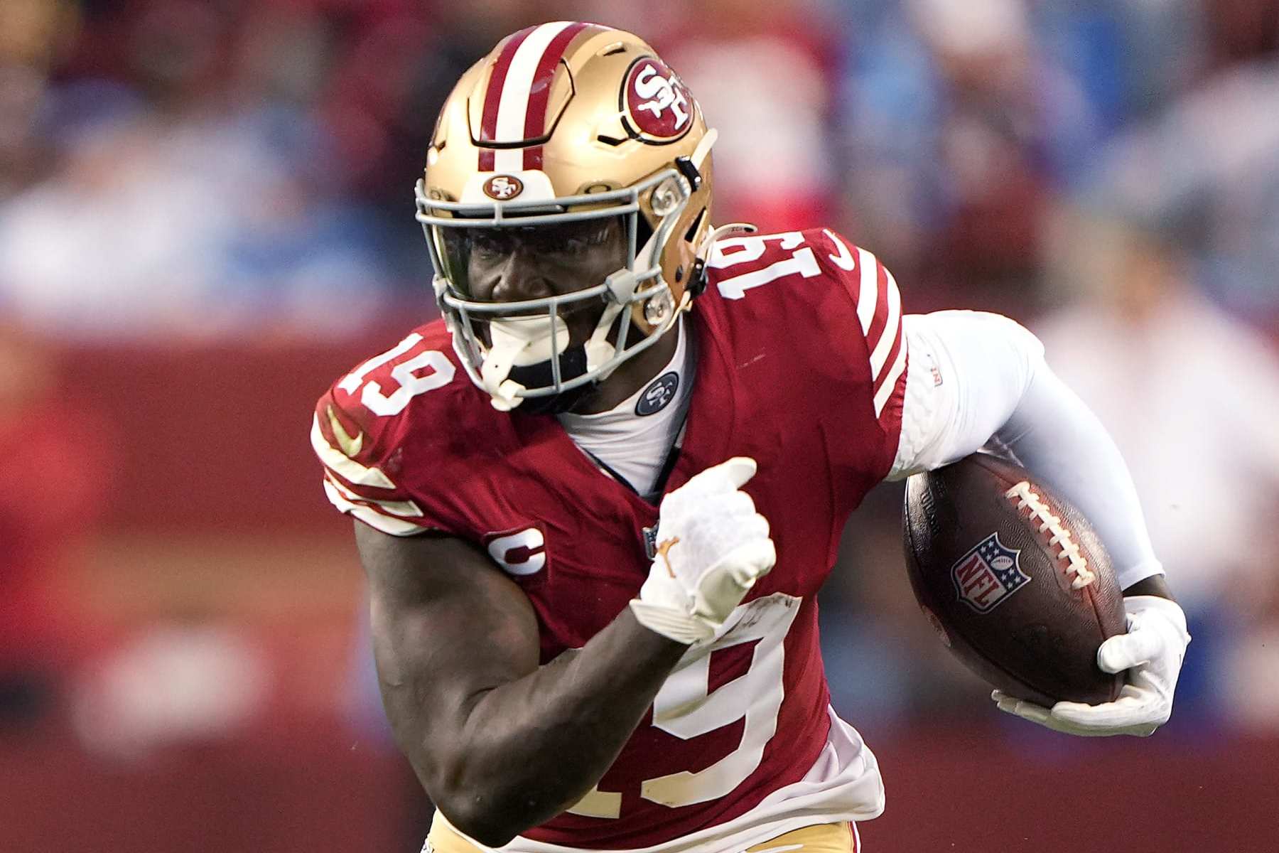 SANTA CLARA, CALIFORNIA - JANUARY 28: Deebo Samuel #19 of the San Francisco 49ers runs with the ball during the third quarter against the Detroit Lions in the NFC Championship Game at Levi's Stadium on January 28, 2024 in Santa Clara, California. (Photo by Thearon W. Henderson/Getty Images)