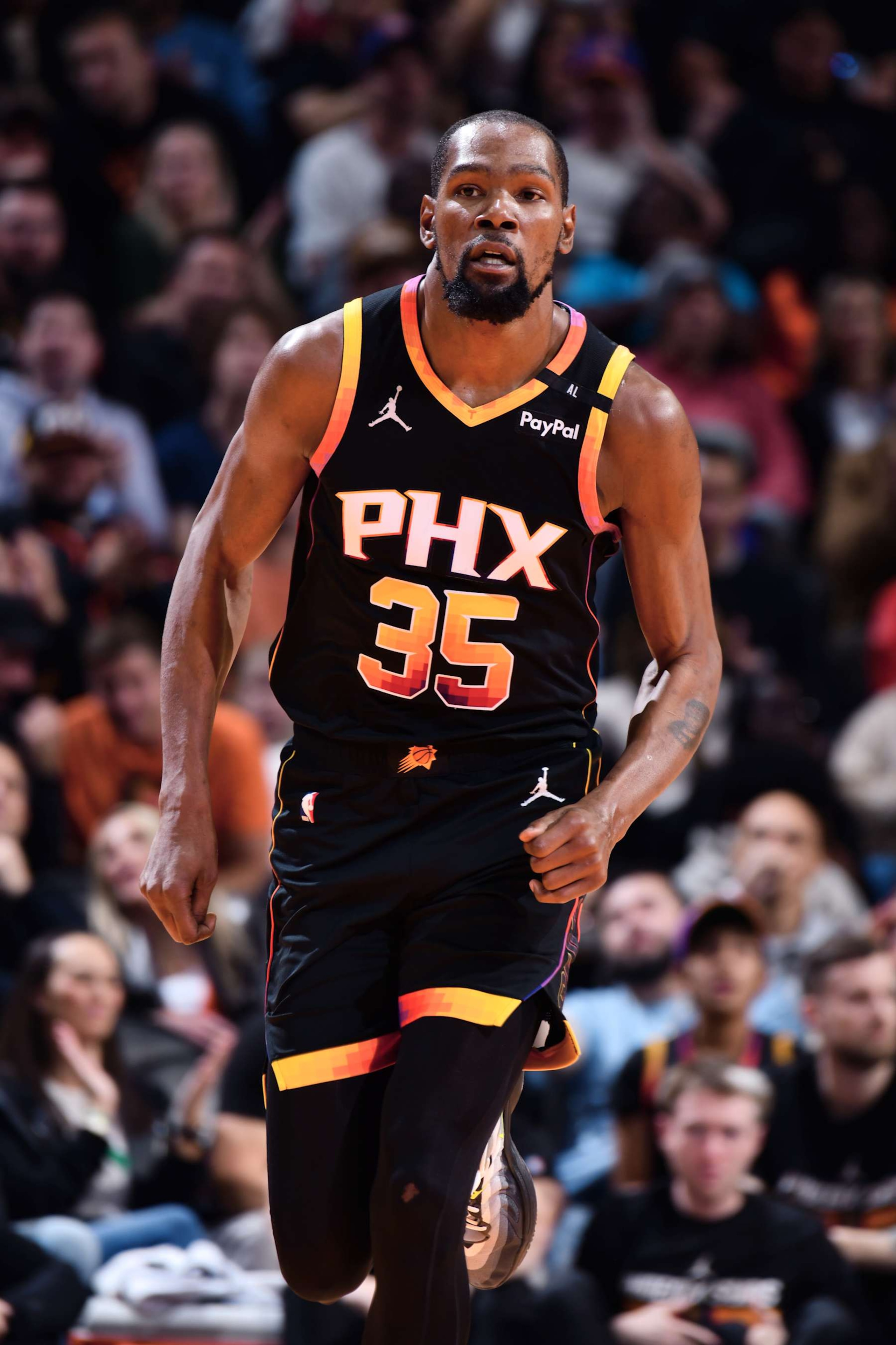 PHOENIX, AZ - DECEMBER 3: Kevin Durant #35 of the Phoenix Suns looks on during the game against the San Antonio Spurs during a Emirates NBA Cup game on December 3, 2024 at Footprint Center in Phoenix, Arizona. NOTE TO USER: User expressly acknowledges and agrees that, by downloading and or using this photograph, user is consenting to the terms and conditions of the Getty Images License Agreement. Mandatory Copyright Notice: Copyright 2024 NBAE (Photo by Barry Gossage/NBAE via Getty Images)