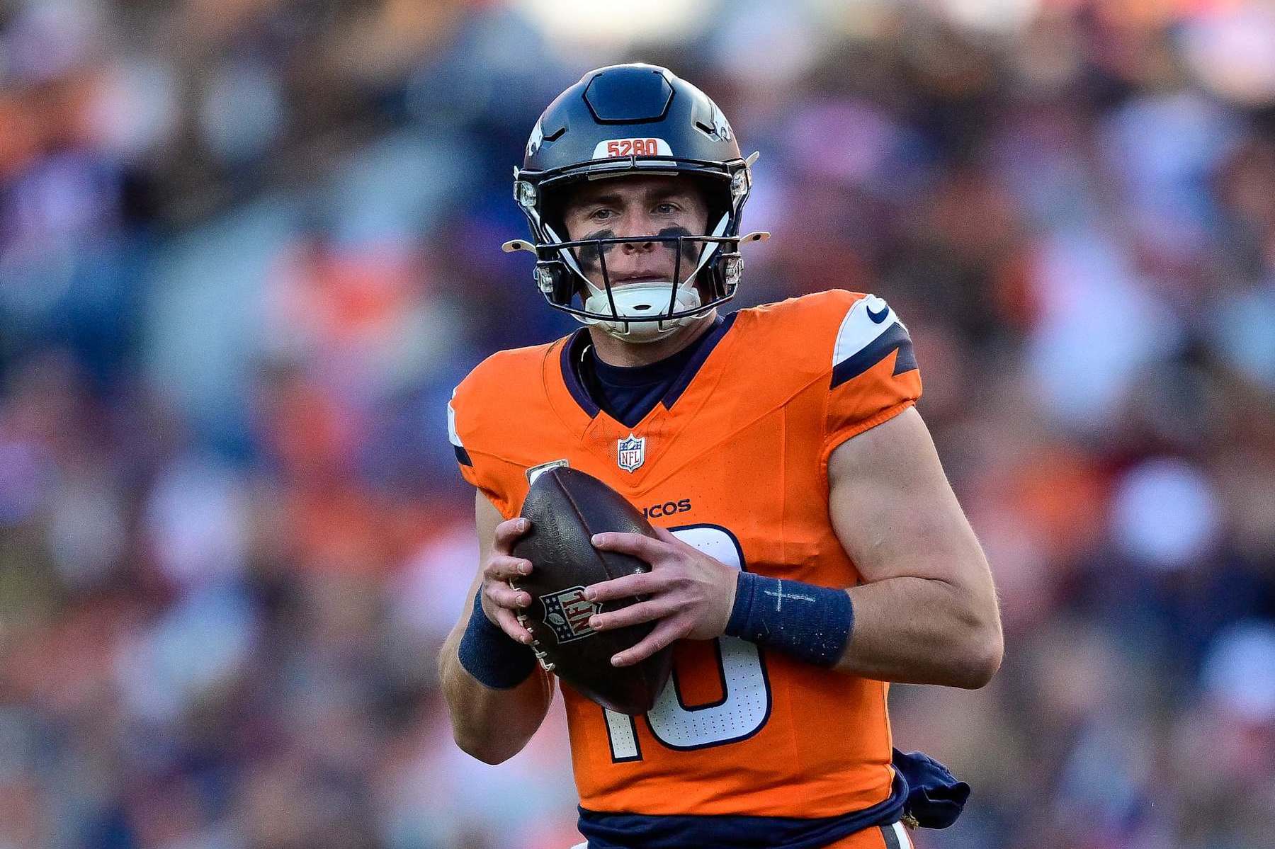 DENVER, COLORADO - NOVEMBER 17: Bo Nix #10 of the Denver Broncos looks downfield in the second half against the Atlanta Falcons at Empower Field at Mile High on November 17, 2024 in Denver, Colorado. (Photo by Dustin Bradford/Getty Images)