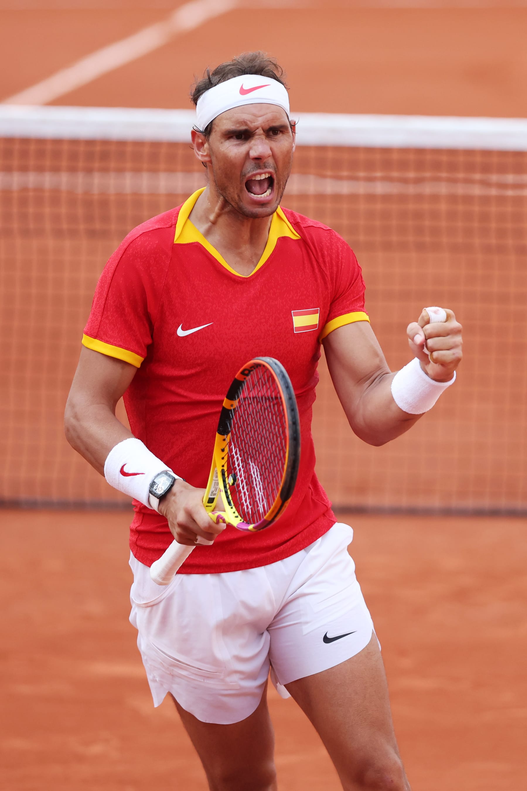 PARIS, FRANCE - JULY 30: Rafael Nadal of Team Spain celebrates with partner (not in frame) Carlos Alcaraz of Team Spain against Tallon Griekspoor of Team Netherlands and Wesley Koolhof of Team Netherlands during the Men's Doubles second round match on day four of the Olympic Games Paris 2024 at Roland Garros on July 30, 2024 in Paris, France. (Photo by Matthew Stockman/Getty Images)