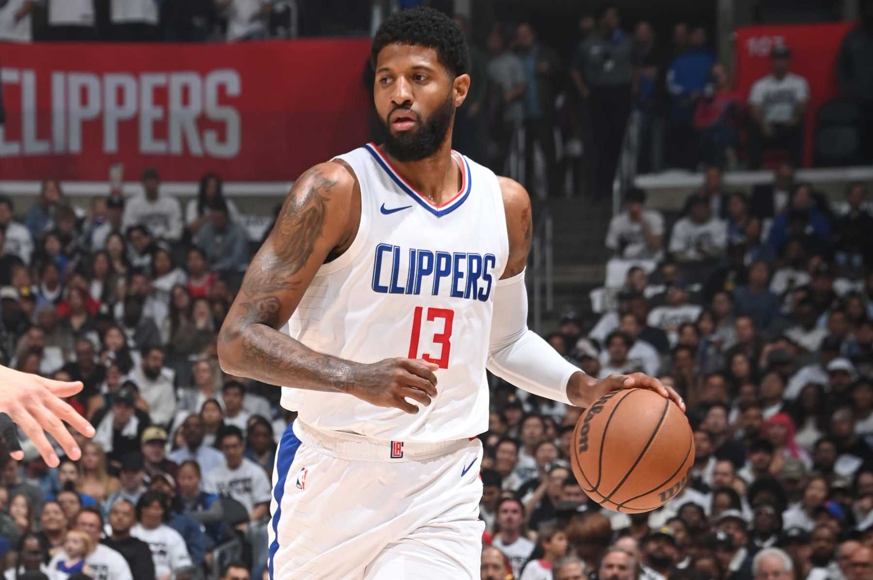 LOS ANGELES, CA - MAY 1:  Paul George #13 of the LA Clippers handles the ball during the game  against the Dallas Mavericks during Round 1 Game 5 of the 2024 NBA Playoffs  on May 1, 2024 at Crypto.Com Arena in Los Angeles, California. NOTE TO USER: User expressly acknowledges and agrees that, by downloading and/or using this Photograph, user is consenting to the terms and conditions of the Getty Images License Agreement. Mandatory Copyright Notice: Copyright 2024 NBAE (Photo by Andrew D. Bernstein/NBAE via Getty Images)