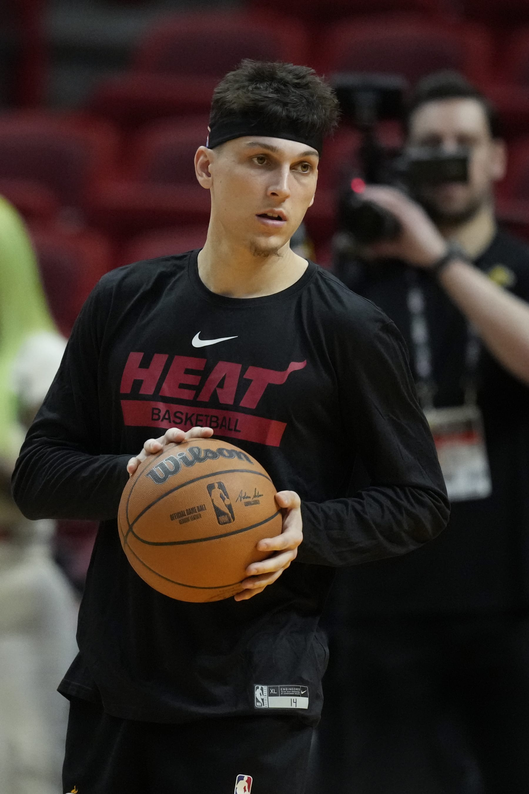 Miami Warmth guard Tyler Herro carries a ball as he watches a group note earlier than Game 3 of the NBA Finals, on the Kaseya Center in Miami, Tuesday, June 6, 2023. (AP Listing/Rebecca Blackwell)