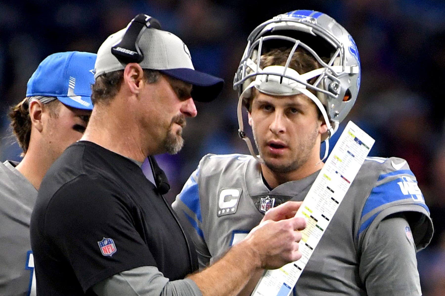 DETROIT, MICHIGAN - DECEMBER 05: Jared Goff #16 of the Detroit Lions talks with head coach Dan Campbell during a timeout during the second quarter against the Minnesota Vikings at Ford Field on December 05, 2021 in Detroit, Michigan. (Photo by Nic Antaya/Getty Images)