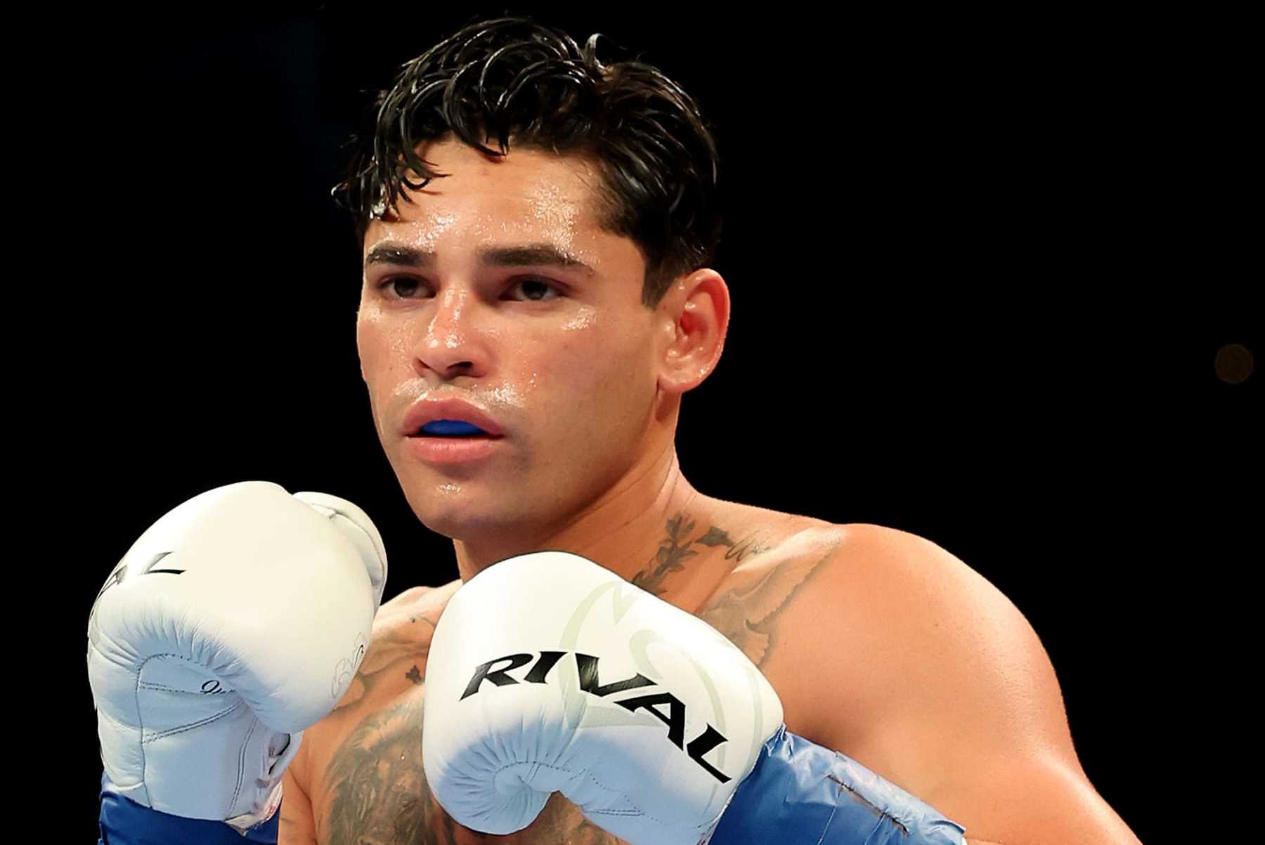 NEW YORK, NEW YORK - APRIL 20: Ryan Garcia (white trunks) prepares to fight Devin Haney during their WBC Super Lightweight title bout at Barclays Center on April 20, 2024 in New York City.  (Photo by Al Bello/Getty Images)