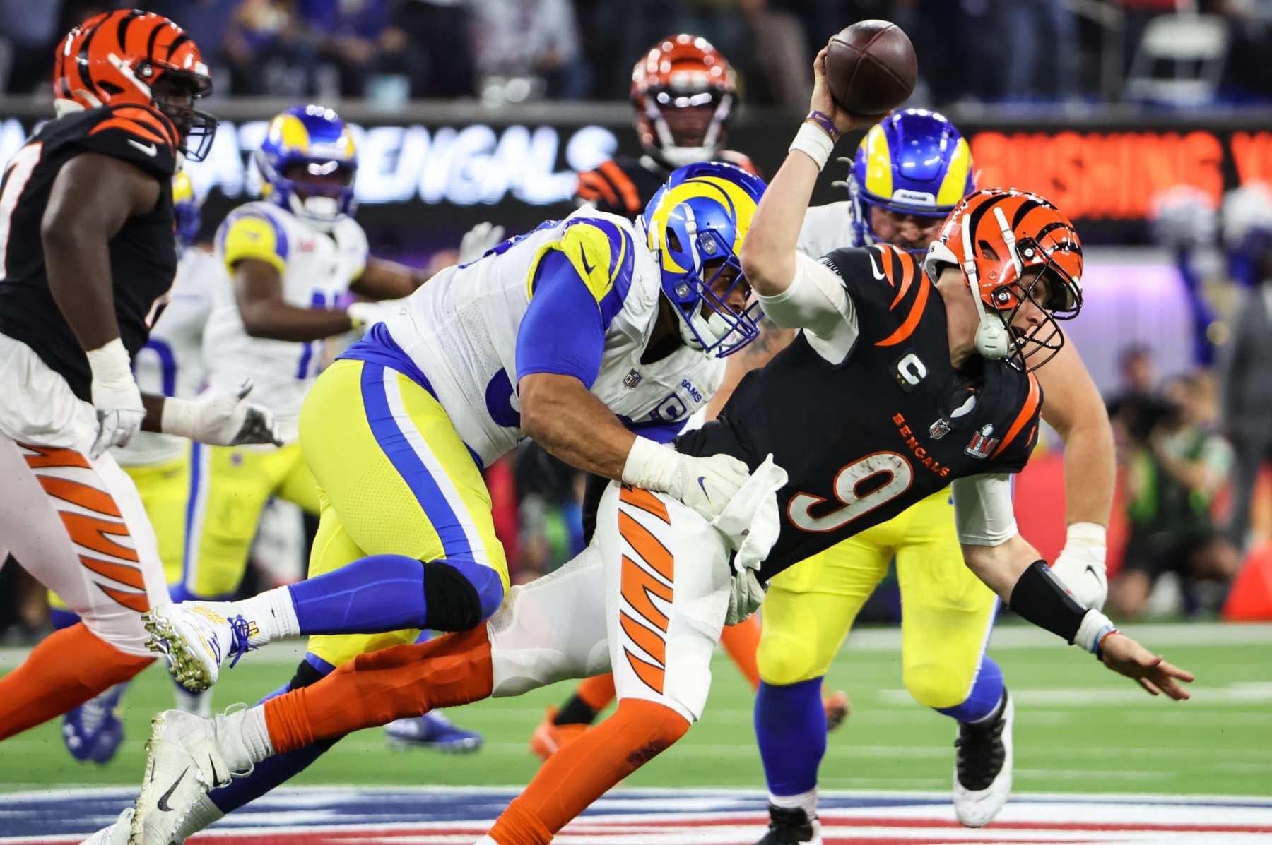 Inglewood, CA - February 13: Los Angeles Rams defensive end Aaron Donald (99) sacks Cincinnati Bengals quarterback Joe Burrow (9) near the end of in Super Bowl LVI at SoFi Stadium on Sunday, Feb. 13, 2022 in Inglewood, CA.(Robert Gauthier / Los Angeles Times via Getty Images)
