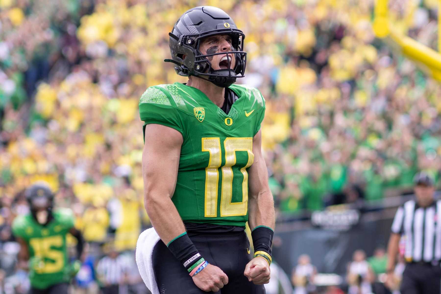 EUGENE, OREGON - SEPTEMBER 23: Quarterback Bo Nix #10 of the Oregon Ducks runs for a touchdown against the Colorado Buffaloes during the first half at Autzen Stadium on September 23, 2023 in Eugene, Oregon. (Photo by Tom Hauck/Getty Images)
