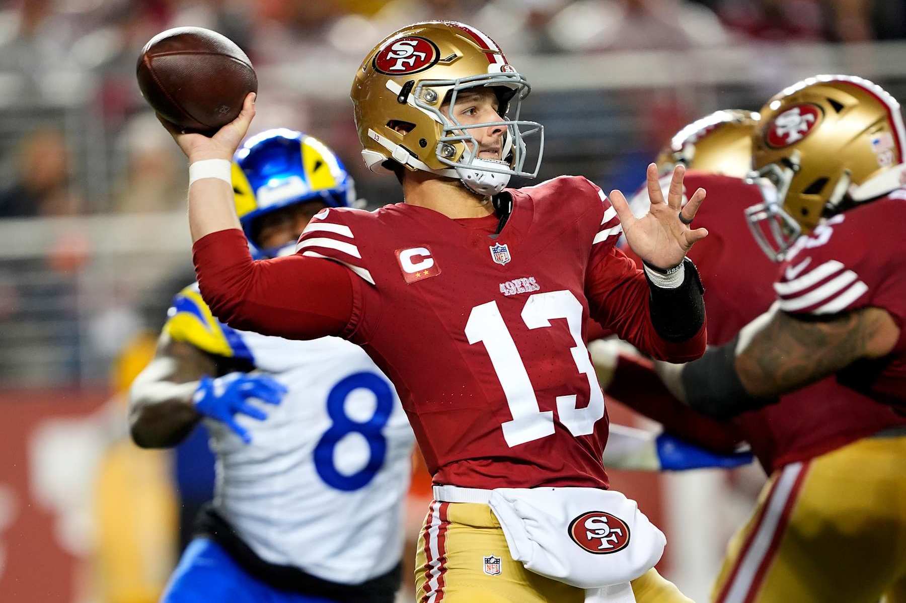 SANTA CLARA, CALIFORNIA - DECEMBER 12: Brock Purdy #13 of the San Francisco 49ers throws a pass against the Los Angeles Rams during the fourth quarter in the game at Levi's Stadium on December 12, 2024 in Santa Clara, California. (Photo by Thearon W. Henderson/Getty Images)